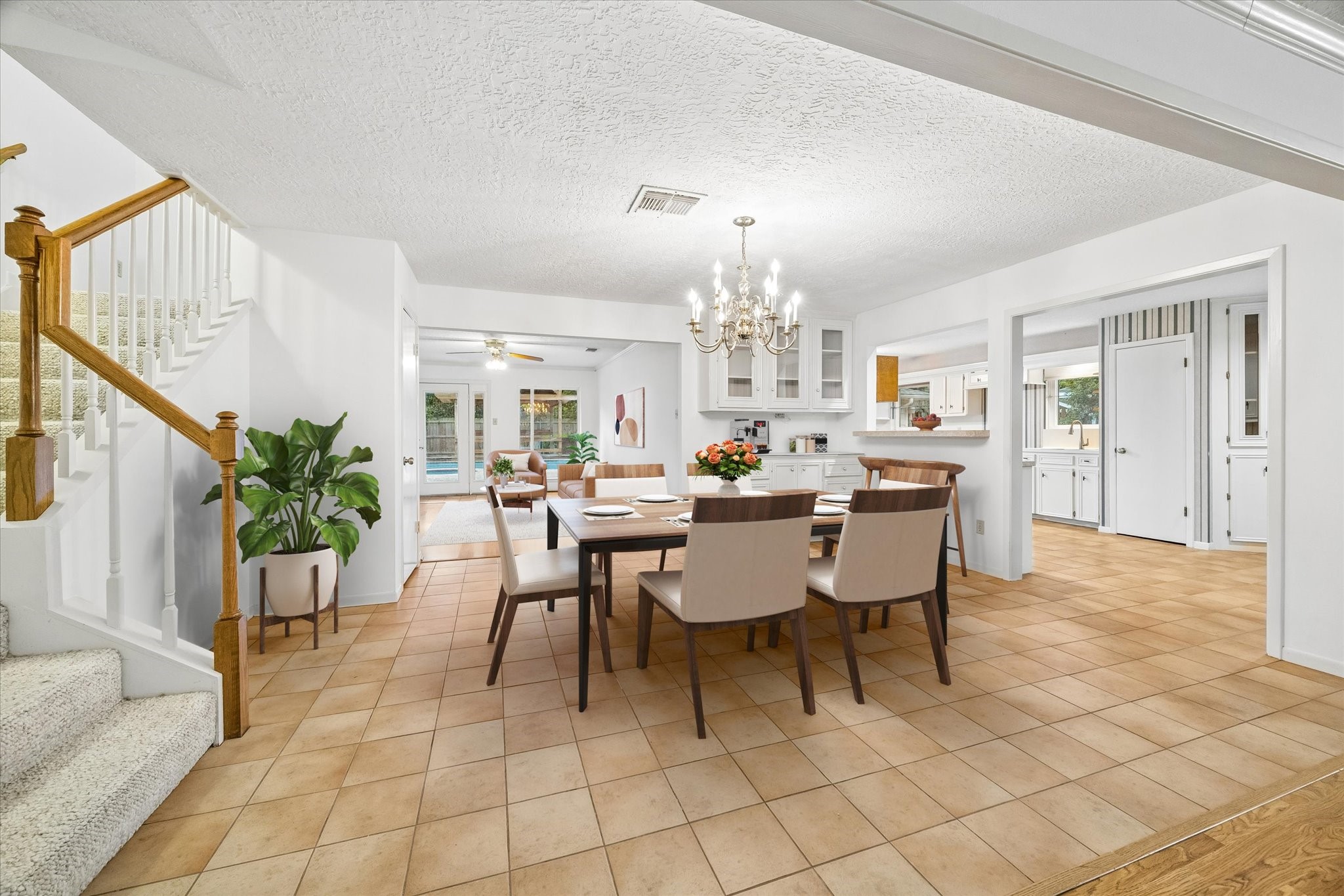 5515 Sylmar Road Houston, TX 77081 - Photo 2 of 28 See how spacious and open the area is from the formal living through the dining area looking toward the family room. this photo has been virtually staged