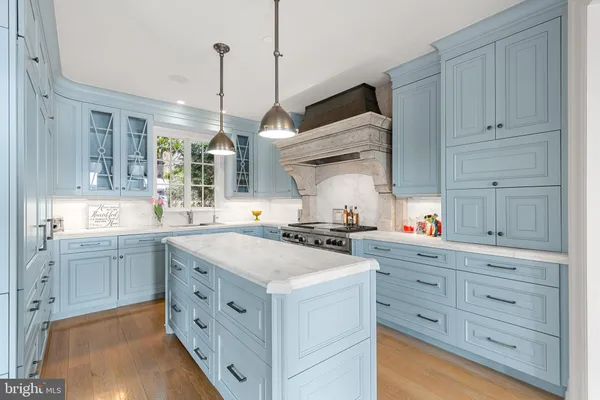a kitchen with a stove a sink and a refrigerator