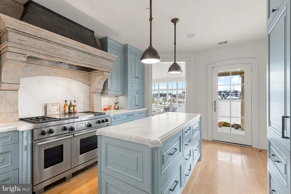 a kitchen that has a stove and a sink