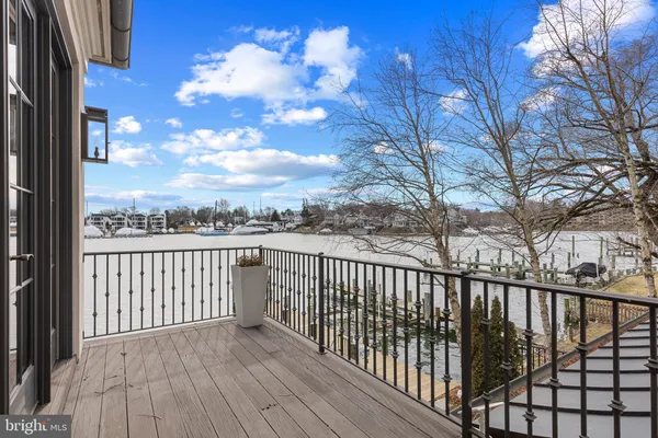 a view of a balcony with wooden fence