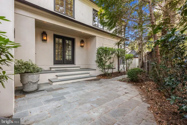 an aerial view of a house yard swimming pool and outdoor seating
