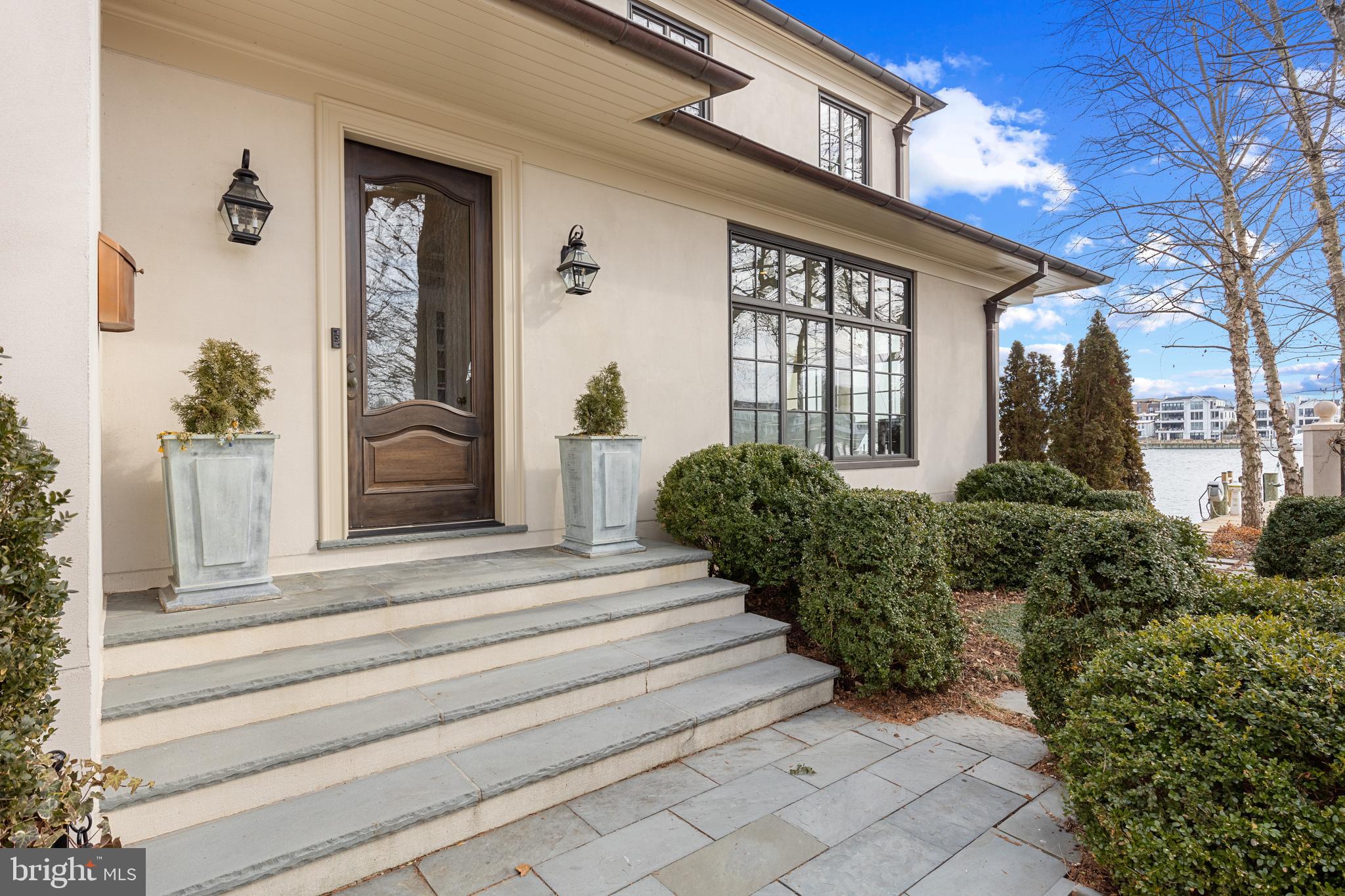 1 Shipwright Harbor Annapolis, MD 21401 - Photo 5 of 39 a front view of a house with potted plants