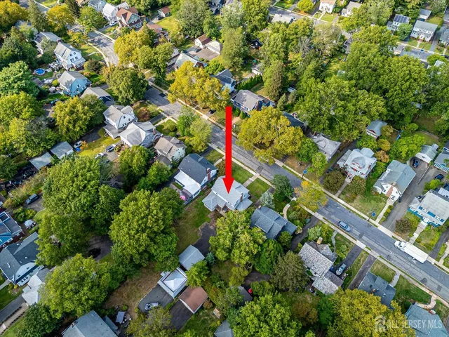 a view of a hallway to a livingroom with furniture