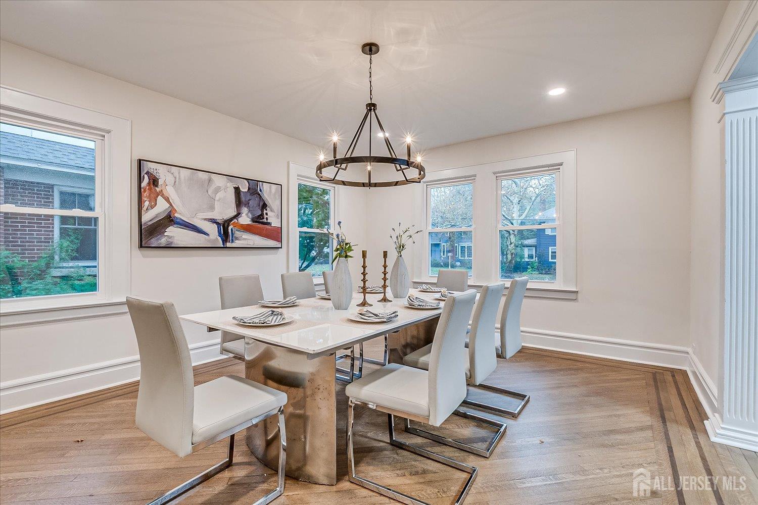 140 Oakview Avenue Maplewood, NJ 07040 - Photo 26 of 67 a dining room with furniture a chandelier and wooden floor