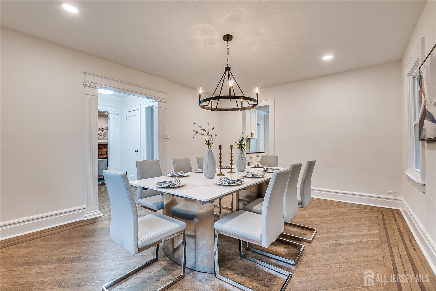 140 Oakview Avenue Maplewood, NJ 07040 - Photo 27 of 67 a dining room with furniture a chandelier and wooden floor
