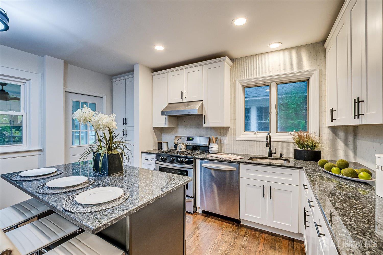 140 Oakview Avenue Maplewood, NJ 07040 - Photo 29 of 67 a kitchen with a sink stove and cabinets