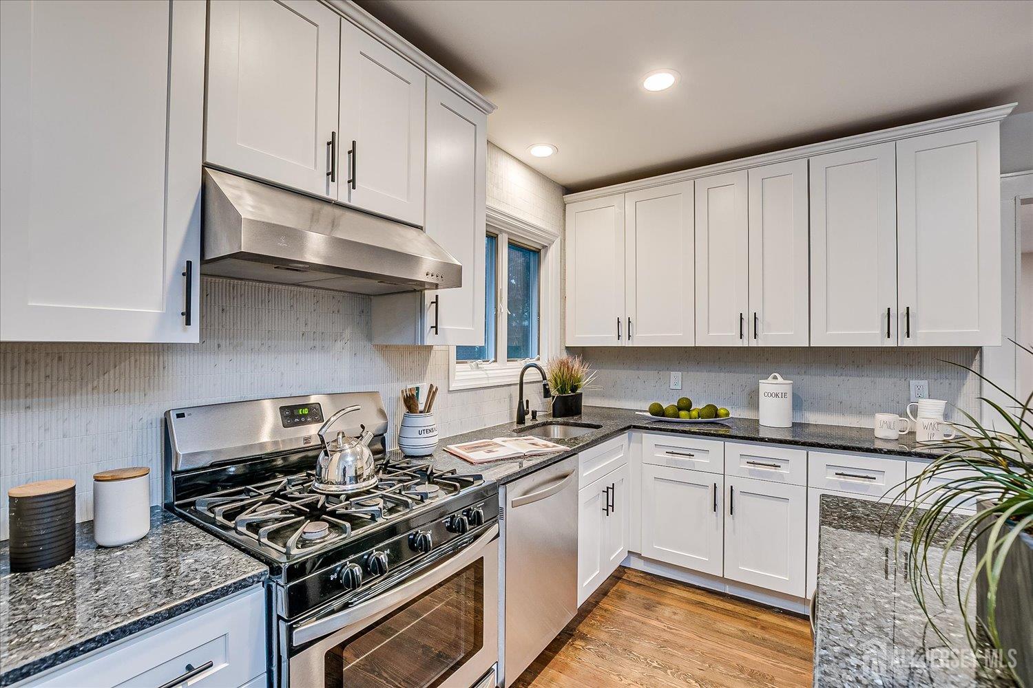 140 Oakview Avenue Maplewood, NJ 07040 - Photo 33 of 67 a kitchen with granite countertop a stove sink and cabinets