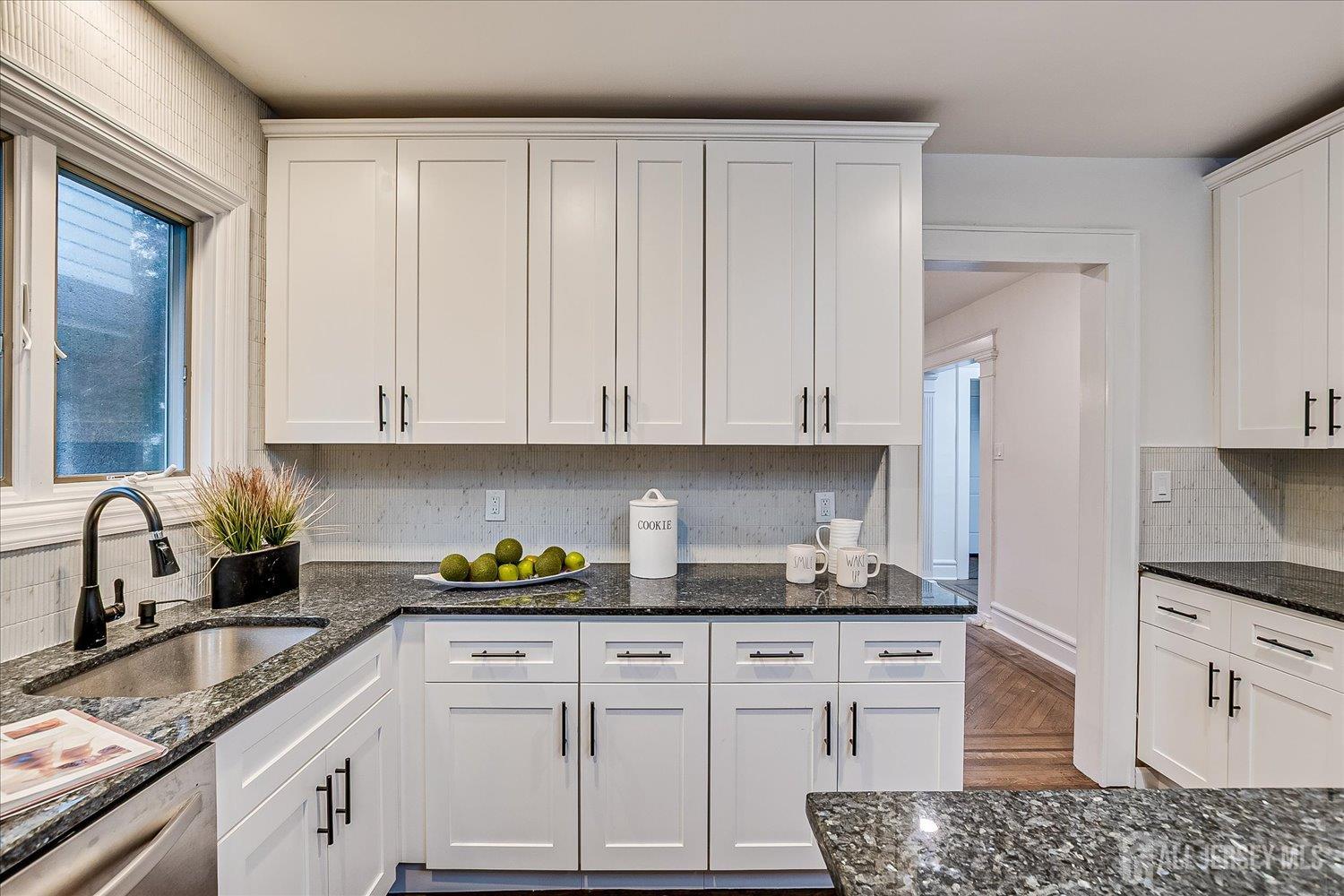 140 Oakview Avenue Maplewood, NJ 07040 - Photo 34 of 67 a kitchen with granite countertop white cabinets and white appliances
