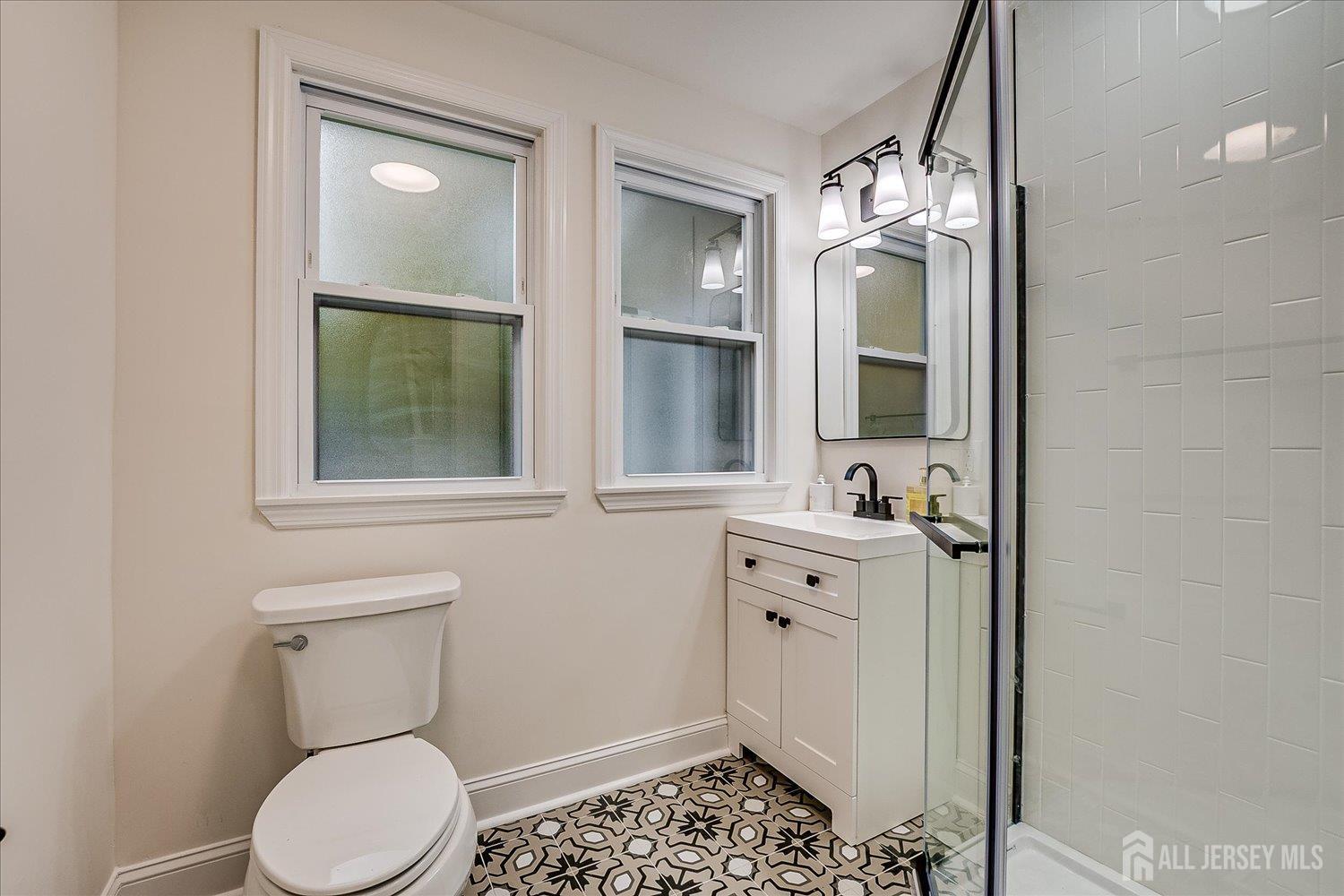 140 Oakview Avenue Maplewood, NJ 07040 - Photo 37 of 67 a bathroom with a toilet sink and mirror
