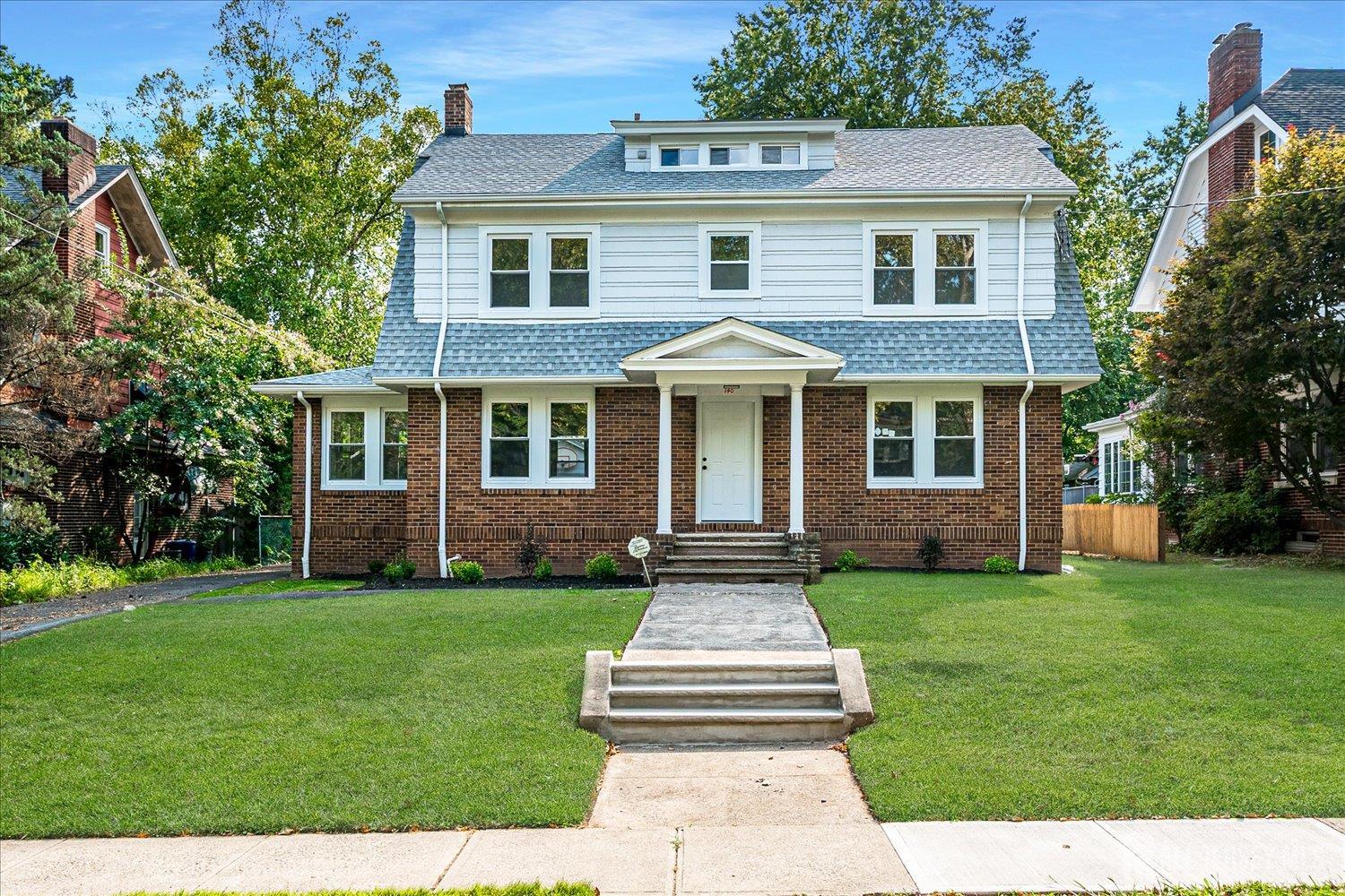 140 Oakview Avenue Maplewood, NJ 07040 - Photo 4 of 67 a front view of a house with a garden
