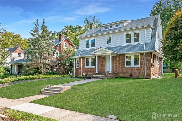 front view of a house with a yard
