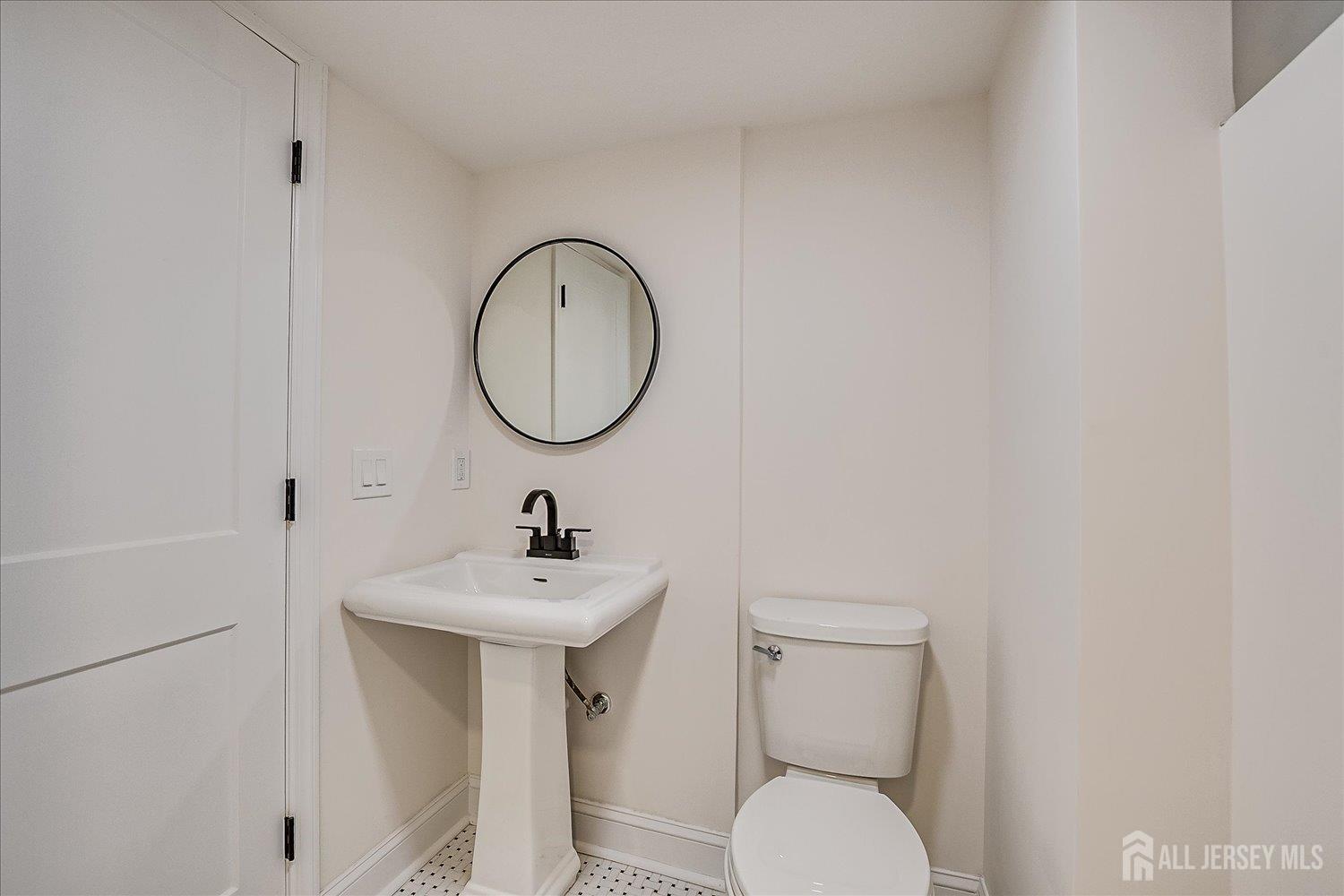 140 Oakview Avenue Maplewood, NJ 07040 - Photo 57 of 67 a bathroom with a sink mirror and toilet