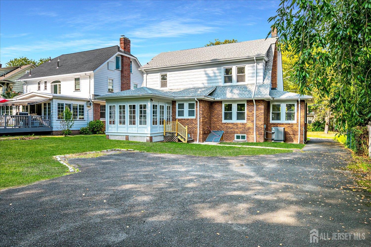140 Oakview Avenue Maplewood, NJ 07040 - Photo 62 of 67 a front view of a house with a yard and trees