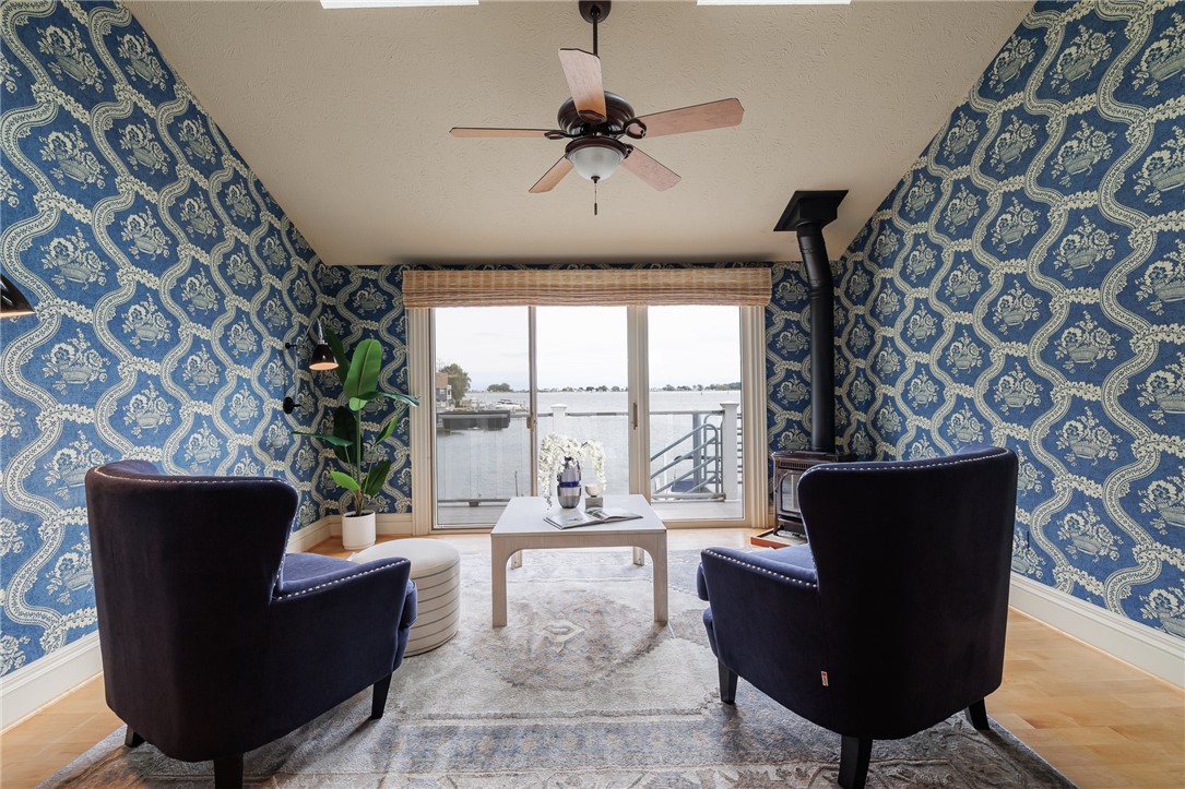 2 Bay Point Circle Irondequoit, NY 14622 - Photo 9 of 49 Sitting room with stunning views and a gas firepla