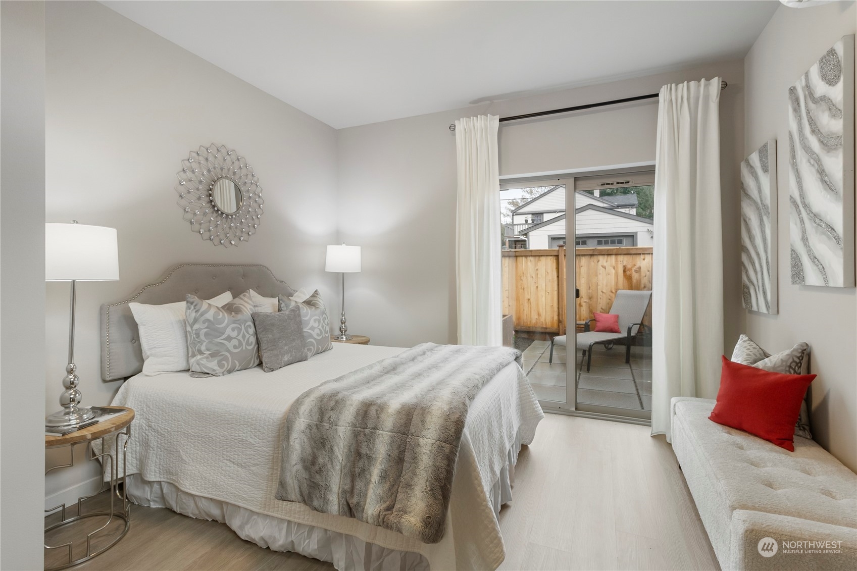 8410 17th Avenue Southwest, Unit B Seattle, WA 98106 - Photo 11 of 18 a bedroom with a bed and a chandelier