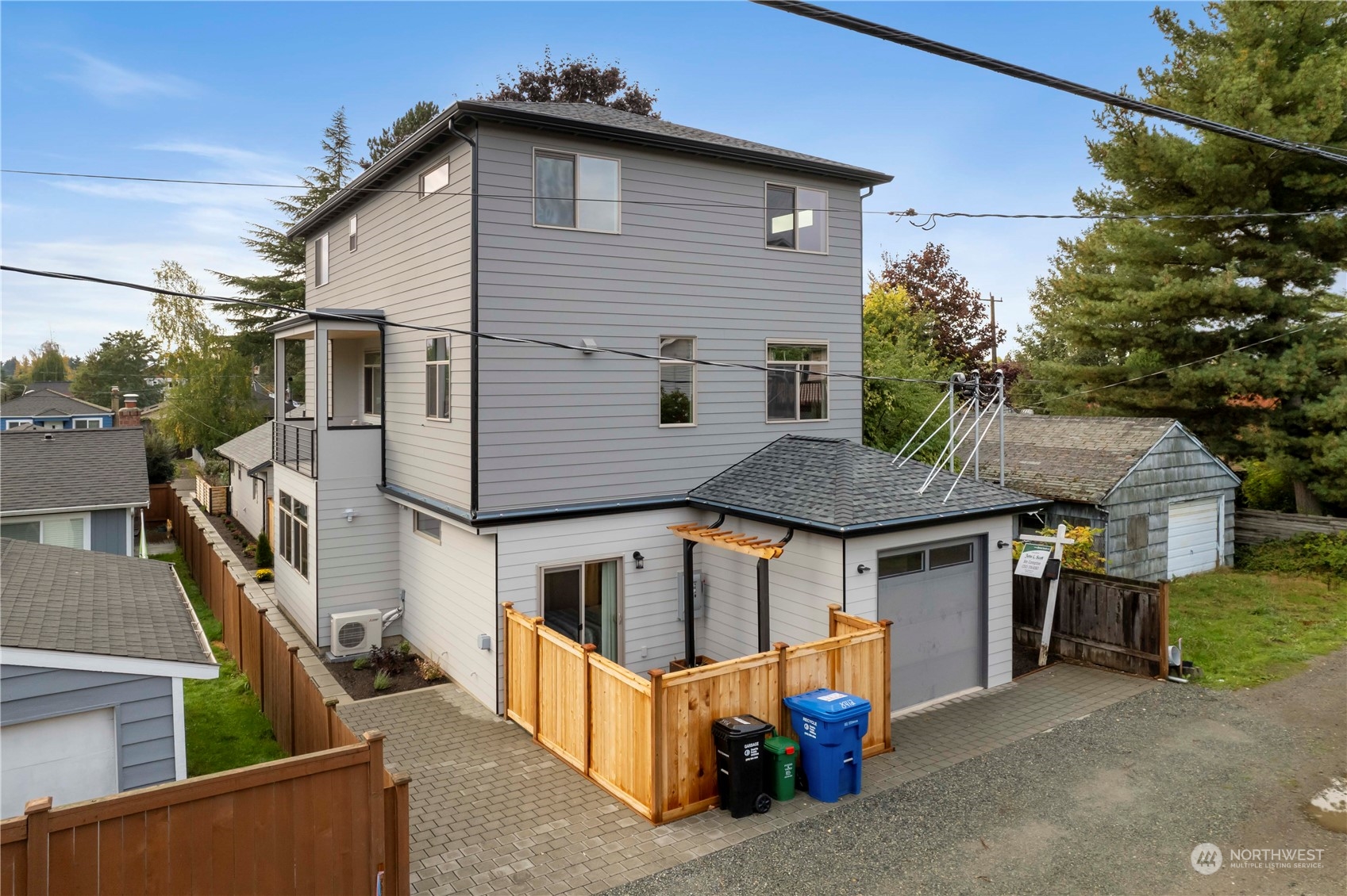 8410 17th Avenue Southwest, Unit B Seattle, WA 98106 - Photo 15 of 18 a front view of a house with garage