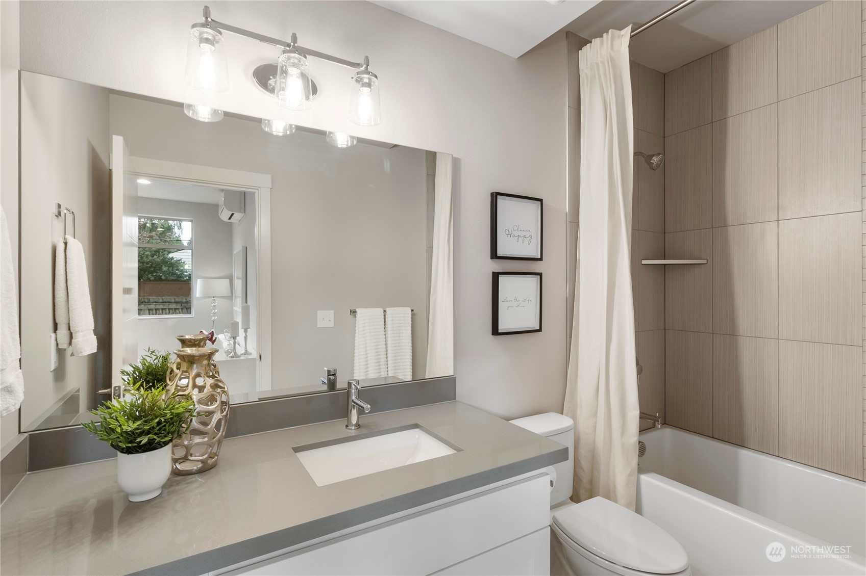 8410 17th Avenue Southwest, Unit B Seattle, WA 98106 - Photo 10 of 18 a bathroom with a granite countertop sink toilet and shower