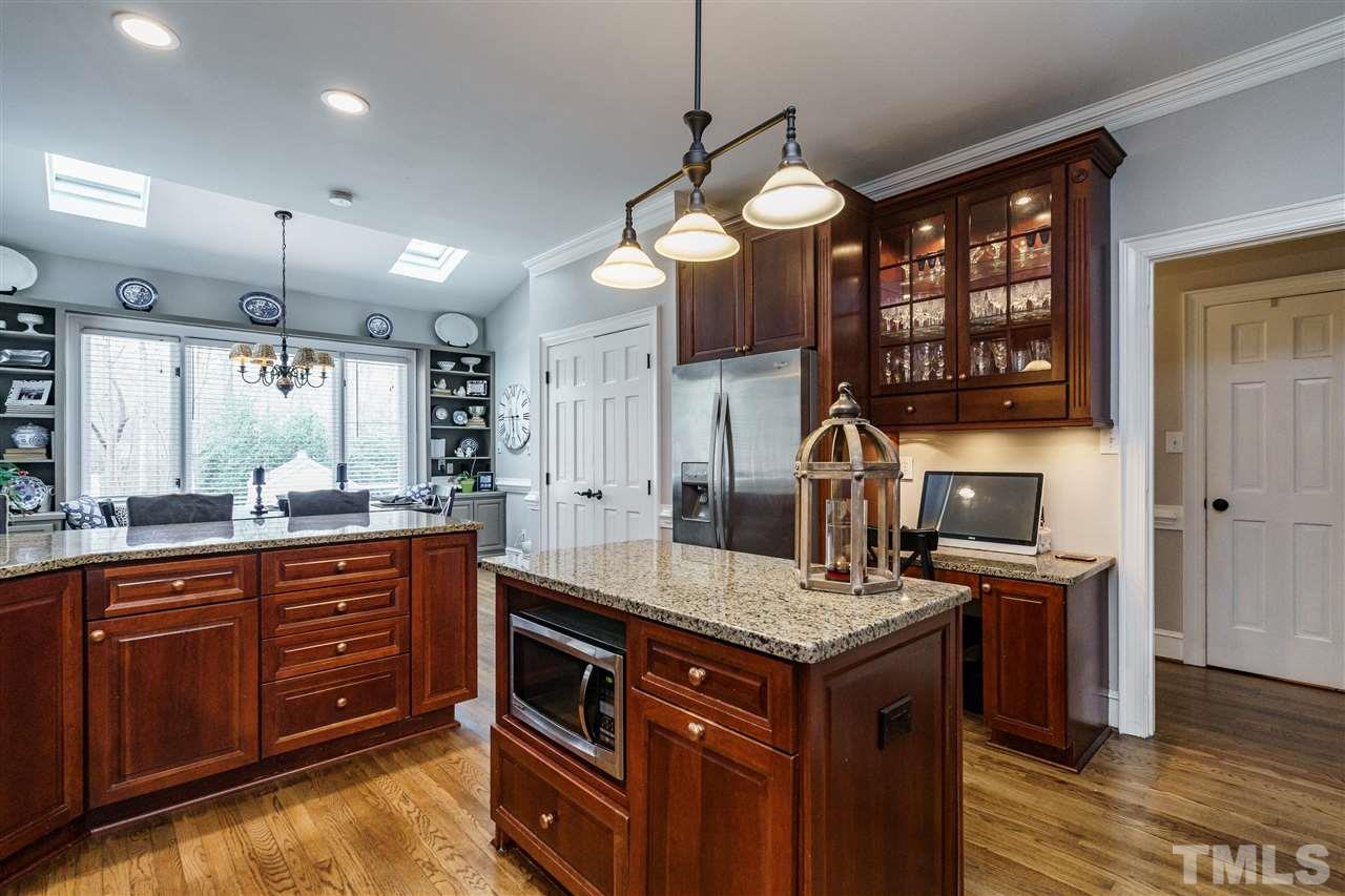 10709 Dunhill Terrace Raleigh, NC 27615 - Photo 12 of 30 Granite countertops, stainless steel appliances and warm hardwood floors are just some of the features.