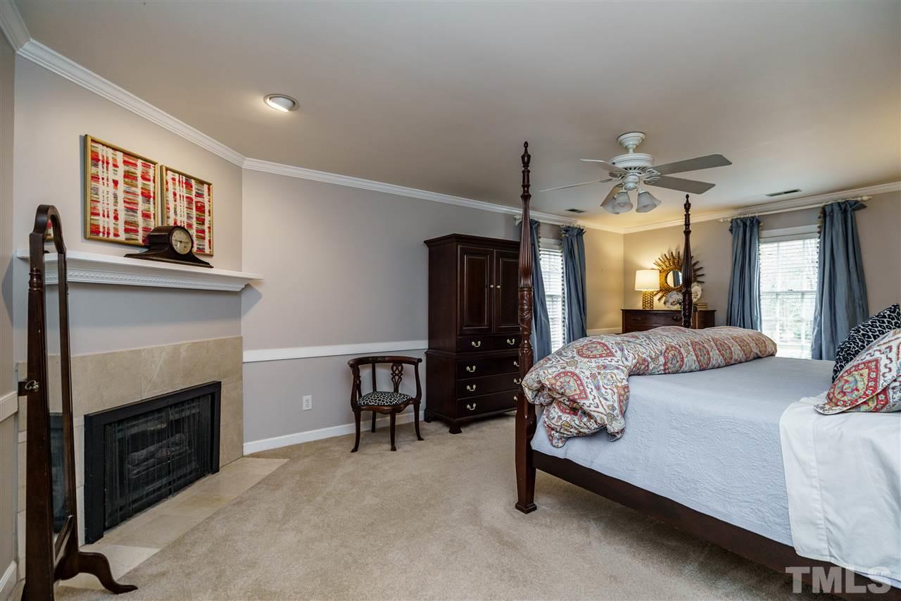 10709 Dunhill Terrace Raleigh, NC 27615 - Photo 16 of 30 Master Bedroom is both large, functional, and cozy at the same time. Fireplace for added ambiance.