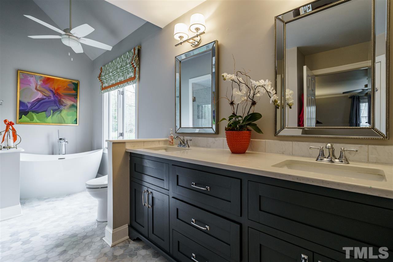 10709 Dunhill Terrace Raleigh, NC 27615 - Photo 18 of 30 This master bath is luxury at its finest! A freestanding tub with casement windows above open up to a completely private view and backyard. Heated floors in the bathroom make you not want to leave!