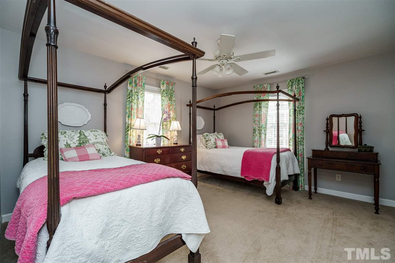 10709 Dunhill Terrace Raleigh, NC 27615 - Photo 20 of 30 Secondary bedroom doesn't feel secondary at all. Large bedroom with beautiful trimwork and detail.