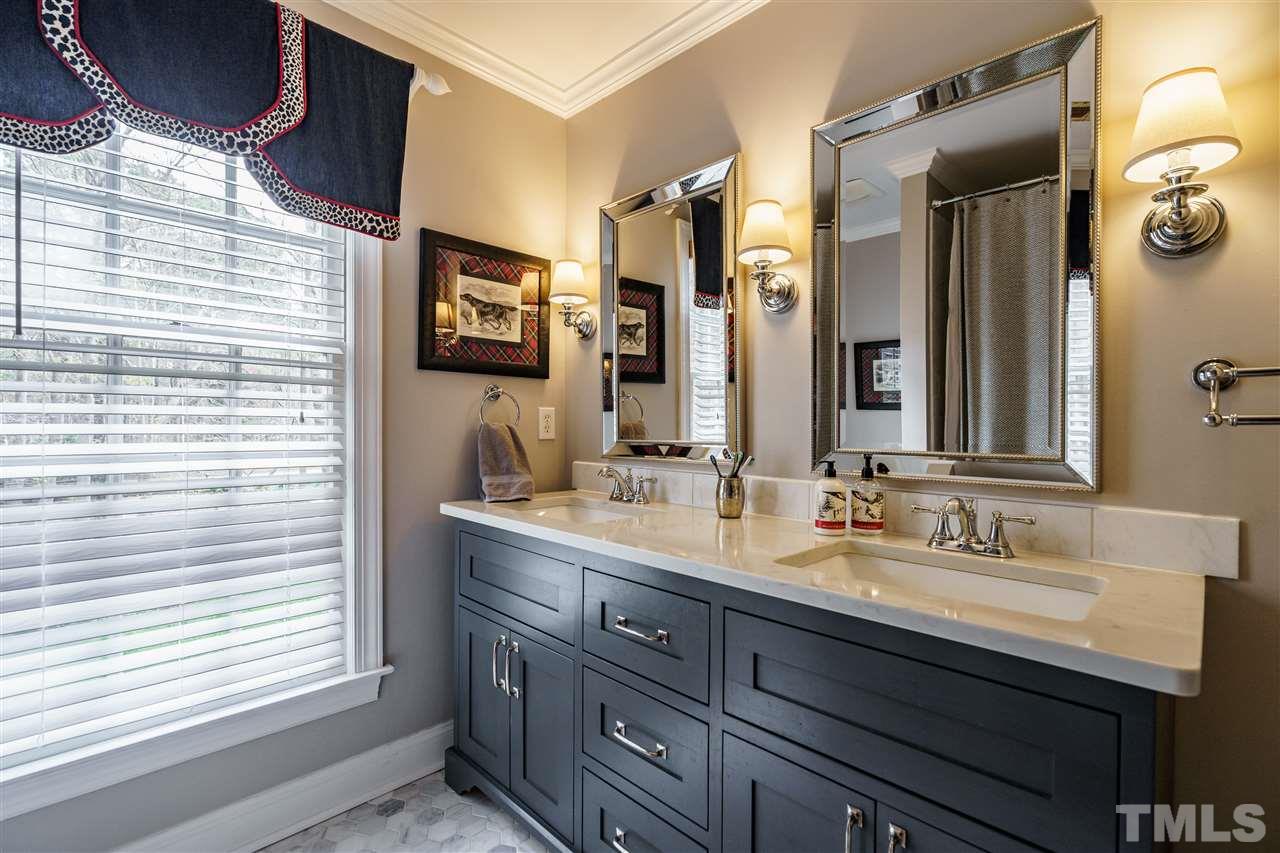 10709 Dunhill Terrace Raleigh, NC 27615 - Photo 21 of 30 Beautifully and tastefully updated bathroom features double vanity.