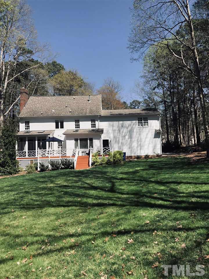 10709 Dunhill Terrace Raleigh, NC 27615 - Photo 28 of 30 Photo from the backyard looking back up to the house. Beautiful flat lot on 1 acre is hard to find in such a great location. Located 5 minutes from great shopping and restaurants. Best of both worlds here!