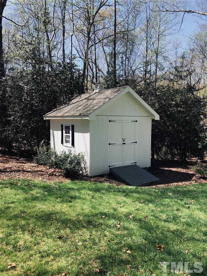 10709 Dunhill Terrace Raleigh, NC 27615 - Photo 29 of 30 Even the out buildings are perfect! Beautifully designed storage area for all of your outdoor projects.