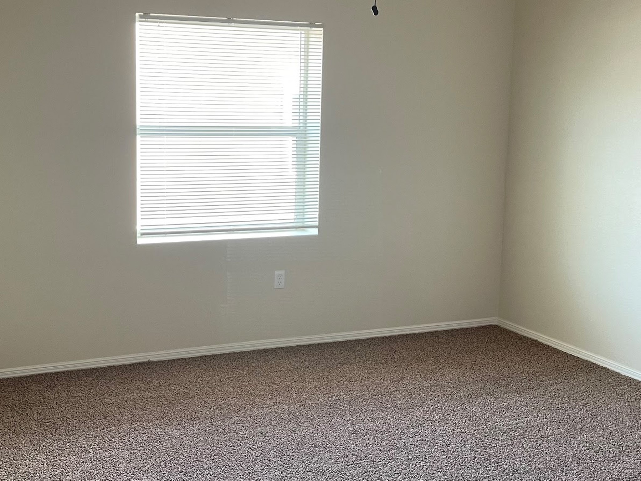 1104 Lechuguilla, Unit 49 Alpine, TX 79830 - Photo 5 of 6 an empty room with a window