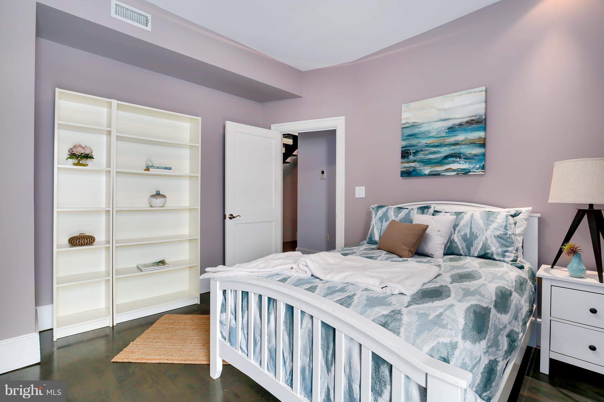 1433 R Street Northwest, Unit 4 Washington, DC 20009 - Photo 11 of 27 a bedroom with a bed and a window