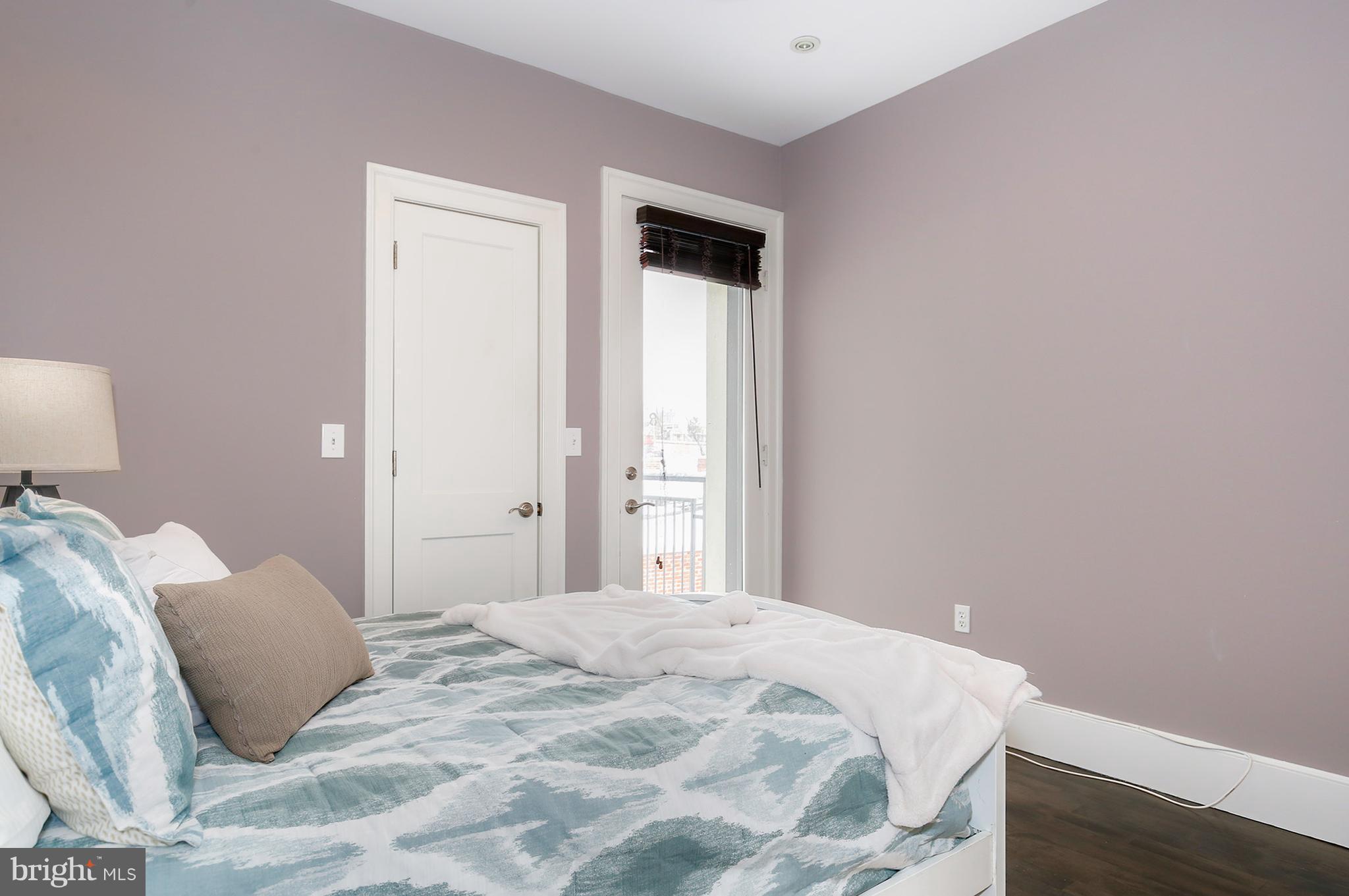 1433 R Street Northwest, Unit 4 Washington, DC 20009 - Photo 12 of 27 a bedroom with a bed and a window