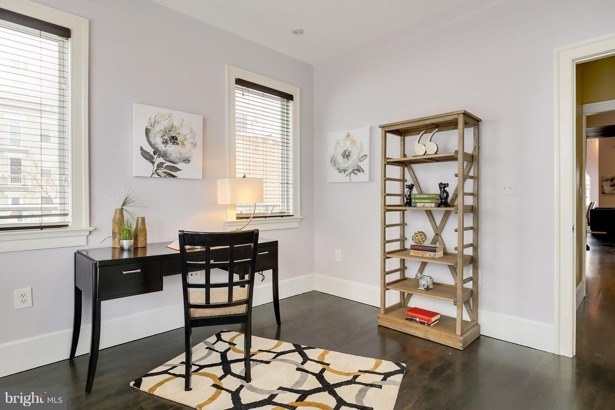 1433 R Street Northwest, Unit 4 Washington, DC 20009 - Photo 13 of 27 a dining room with wooden floor and a window