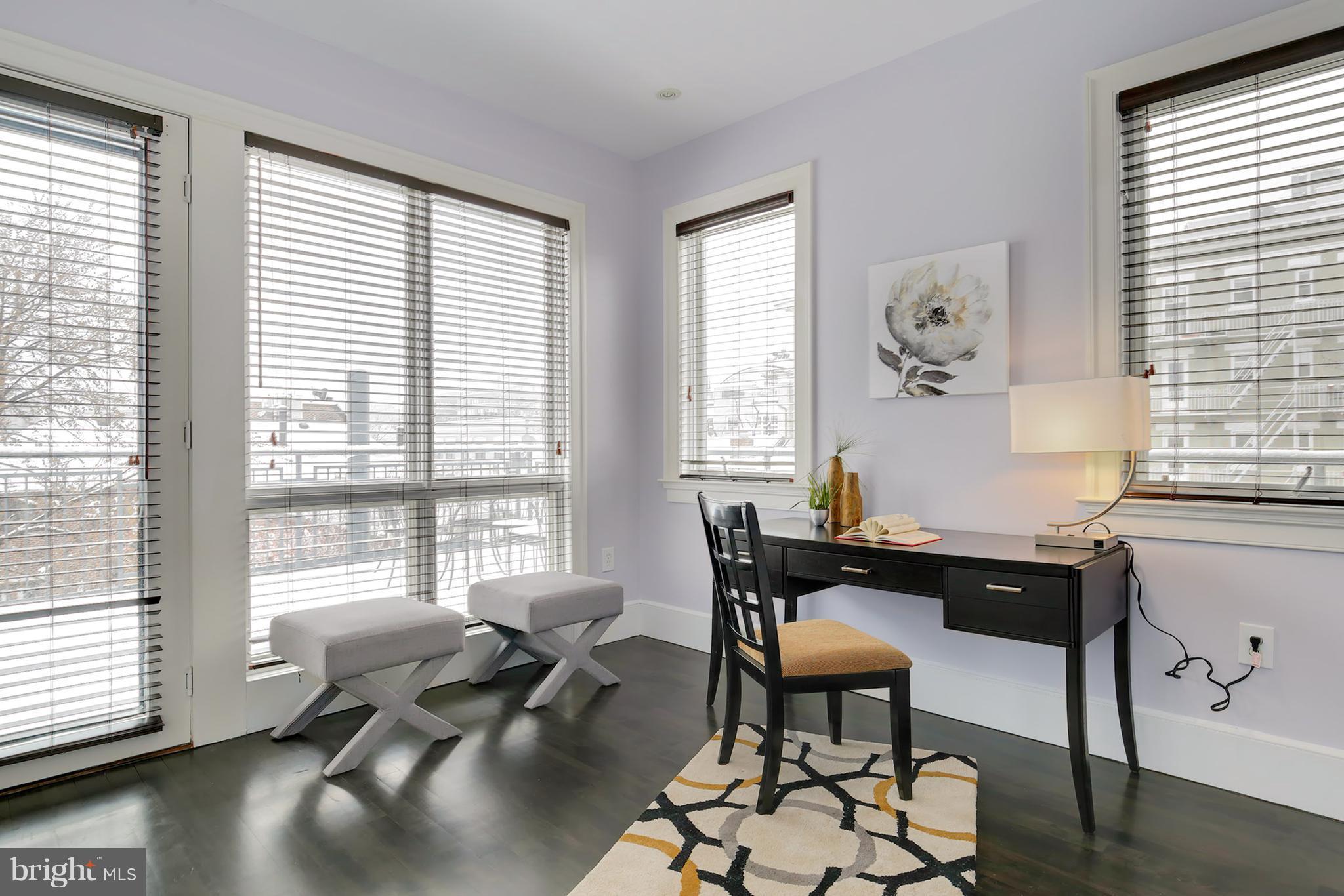 1433 R Street Northwest, Unit 4 Washington, DC 20009 - Photo 14 of 27 a workspace with furniture and a large window