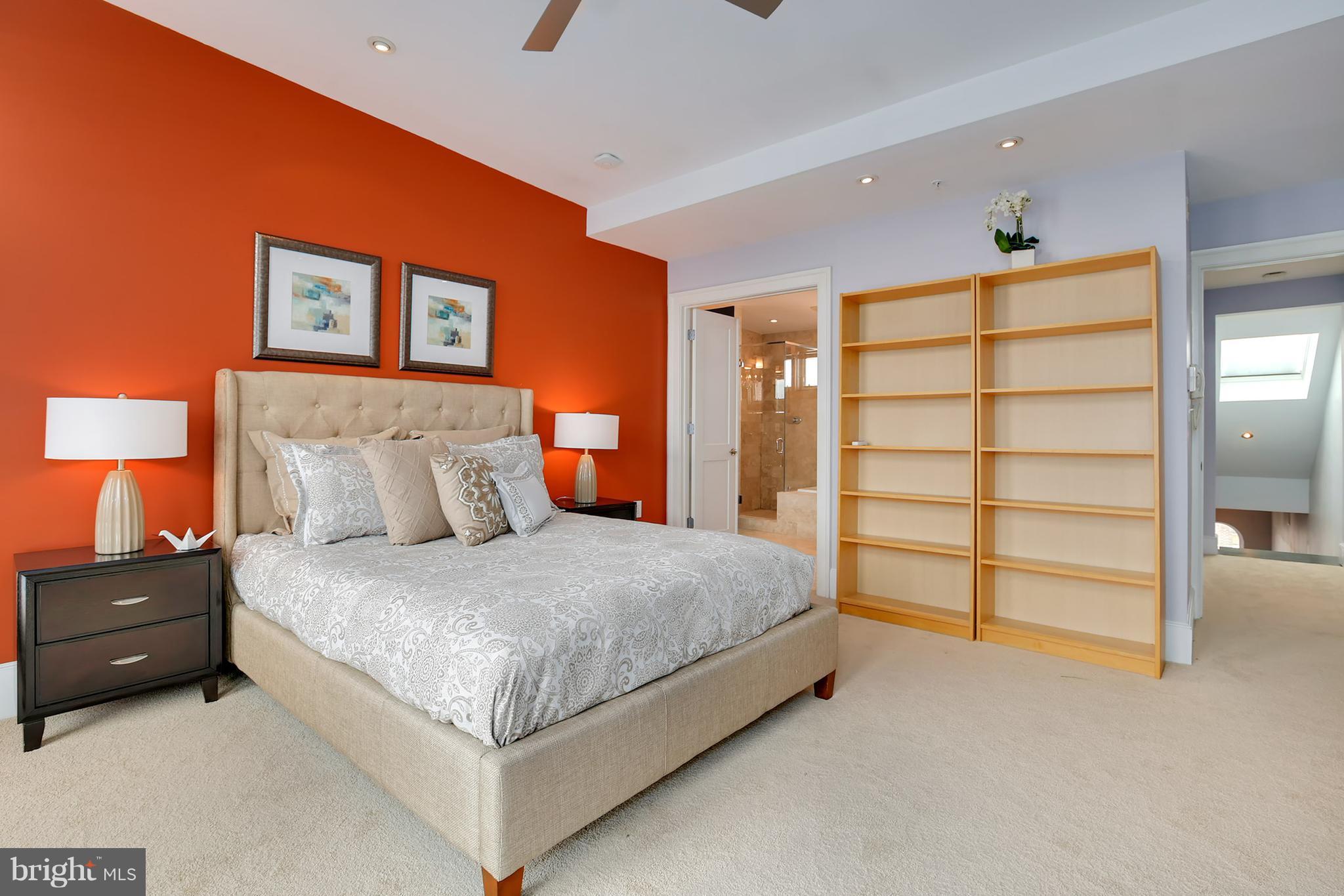 1433 R Street Northwest, Unit 4 Washington, DC 20009 - Photo 20 of 27 a spacious bedroom with a bed and a walk in closet