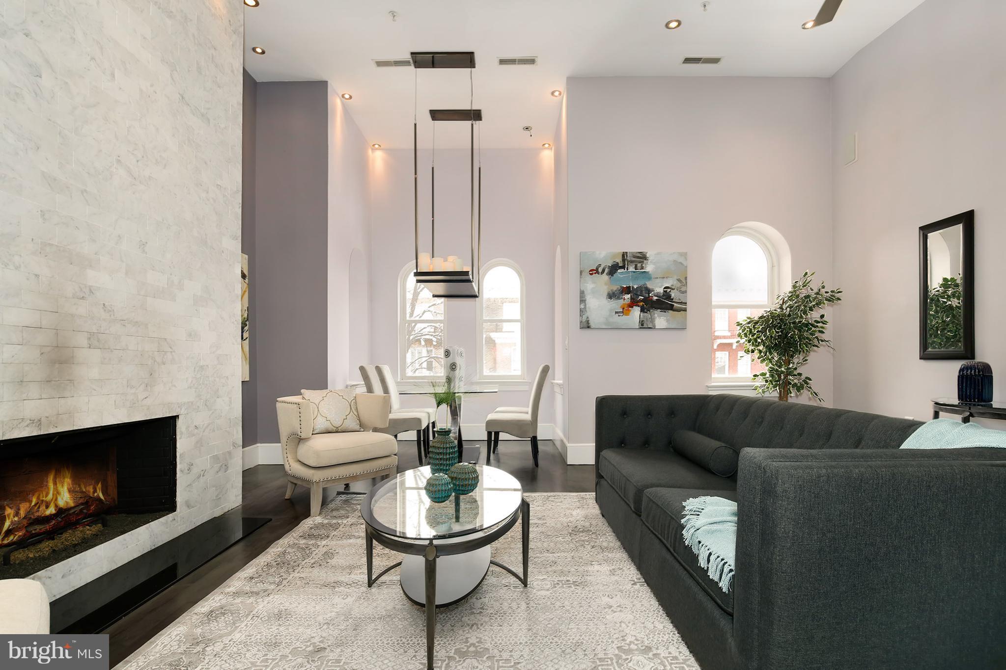 1433 R Street Northwest, Unit 4 Washington, DC 20009 - Photo 3 of 27 a living room with furniture and a fireplace
