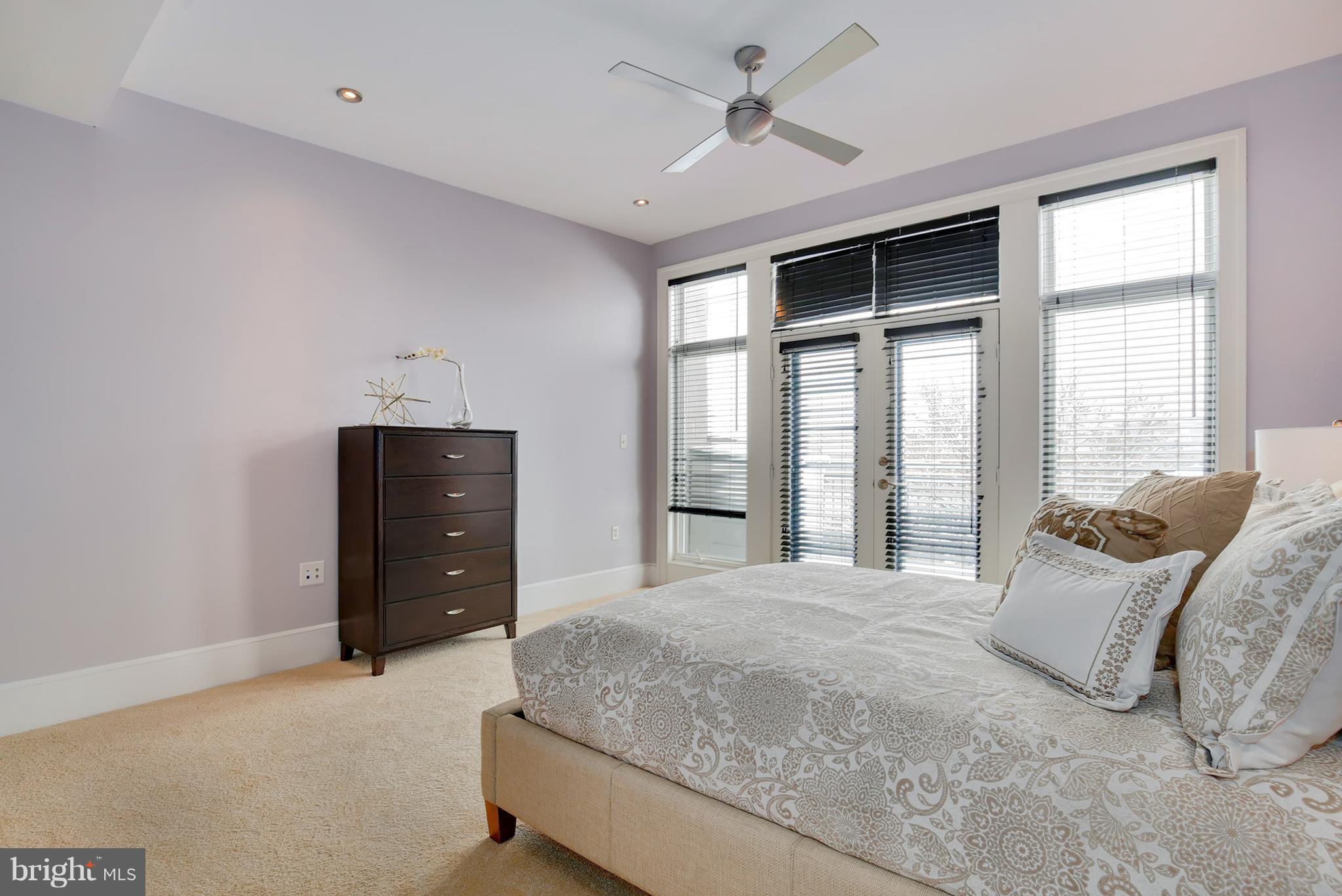 1433 R Street Northwest, Unit 4 Washington, DC 20009 - Photo 21 of 27 a bedroom with a bed and a ceiling fan