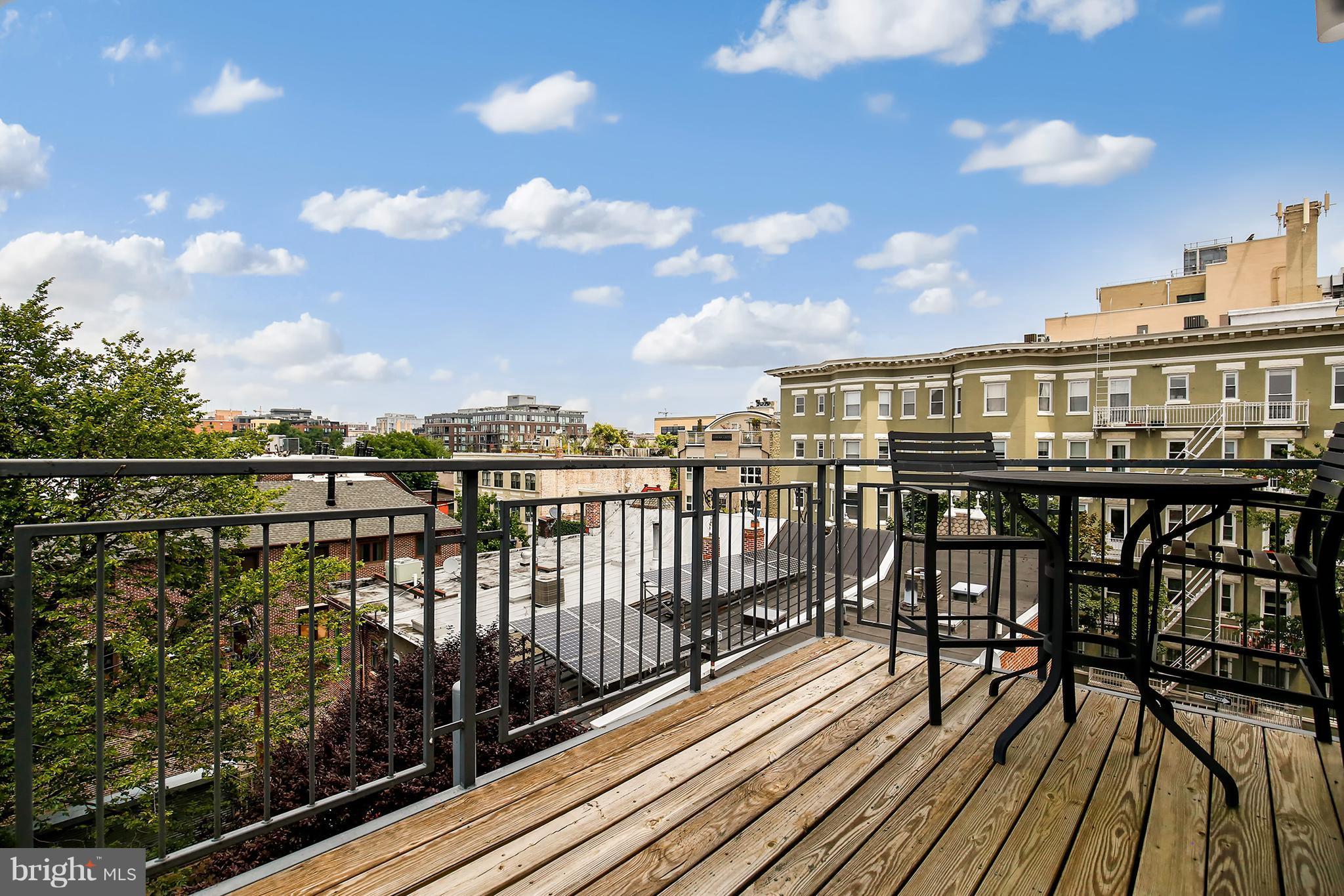 1433 R Street Northwest, Unit 4 Washington, DC 20009 - Photo 25 of 27 a view of a balcony with wooden floor and city view