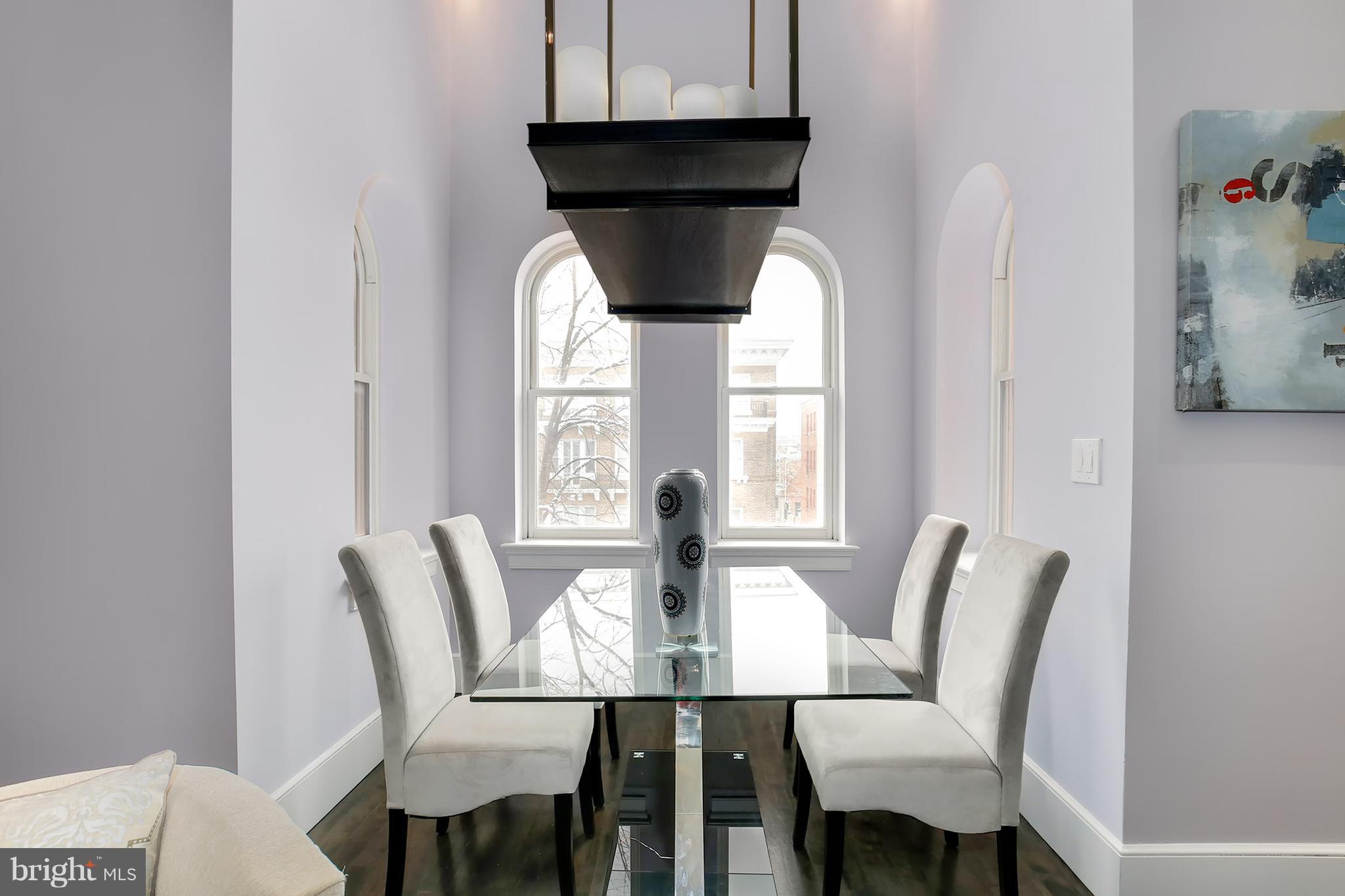 1433 R Street Northwest, Unit 4 Washington, DC 20009 - Photo 4 of 27 a view of a dining room with furniture and window