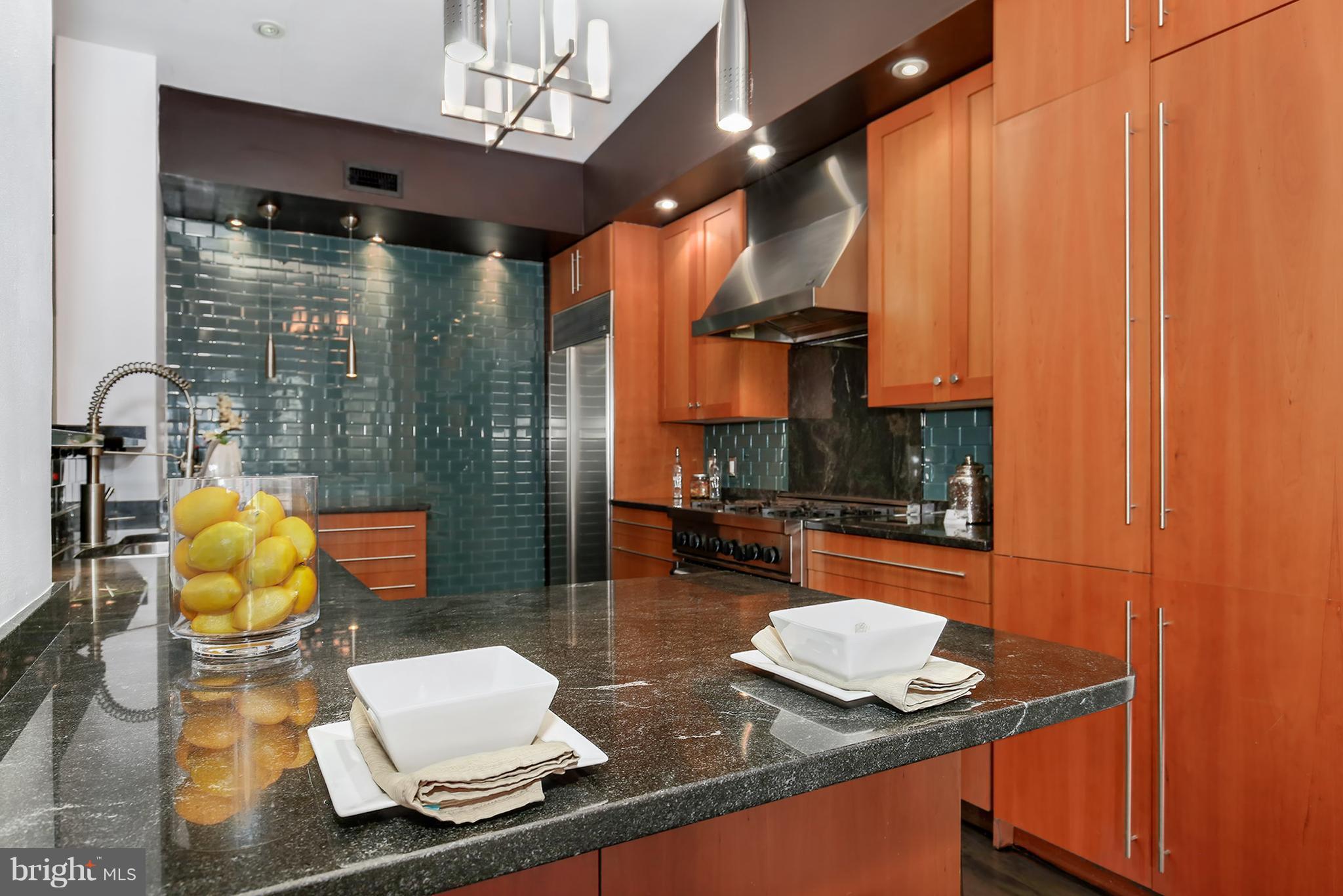 1433 R Street Northwest, Unit 4 Washington, DC 20009 - Photo 6 of 27 a room with chairs and a table with potted plants