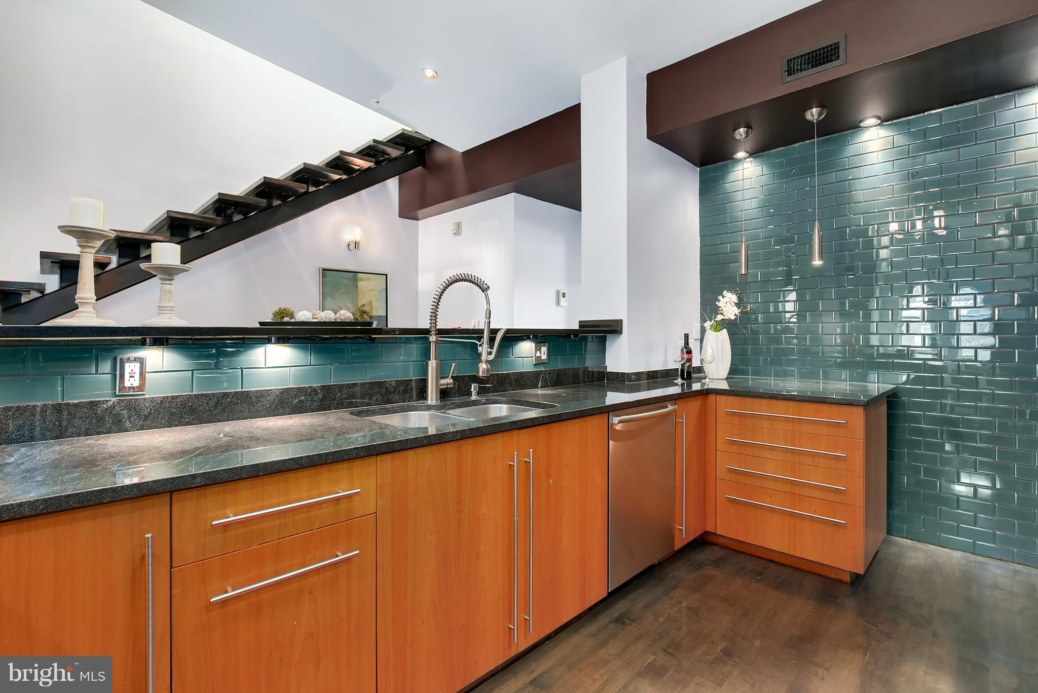 1433 R Street Northwest, Unit 4 Washington, DC 20009 - Photo 7 of 27 a large kitchen with granite countertop a sink and cabinets