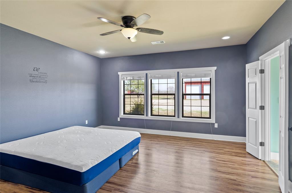 395 Yacht Club Road Oak Point, TX 75068 - Photo 18 of 23 Bedroom featuring wood finished floors, ceiling fan, and recessed lighting