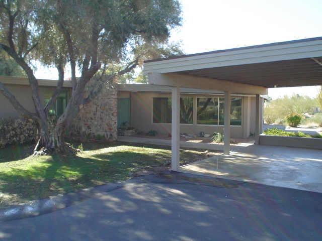 6642 North Praying Monk Road Paradise Valley, AZ 85253 - Photo 1 of 1 a view of a house with backyard porch and sitting area