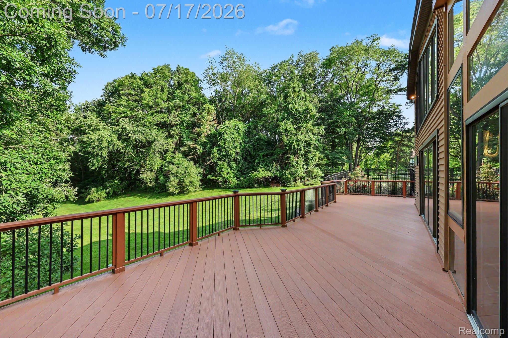 5685 Paint Valley Drive Rochester, MI 48306 - Photo 39 of 66 Spacious outdoor deck featuring composite decking and black metal balusters