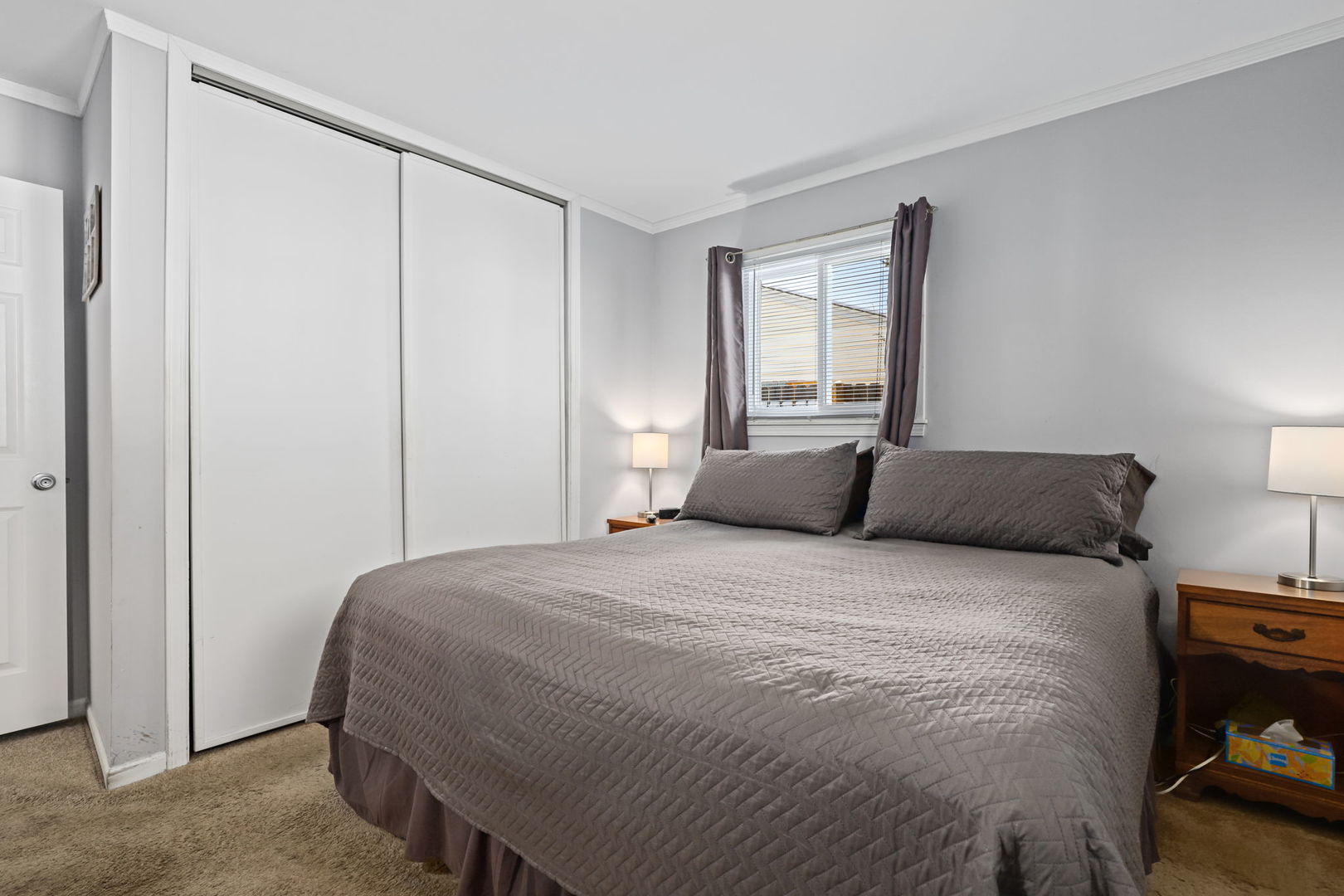 712 South Wayne Place Wheeling, IL 60090 - Photo 12 of 22 a bedroom with a bed and wooden floor