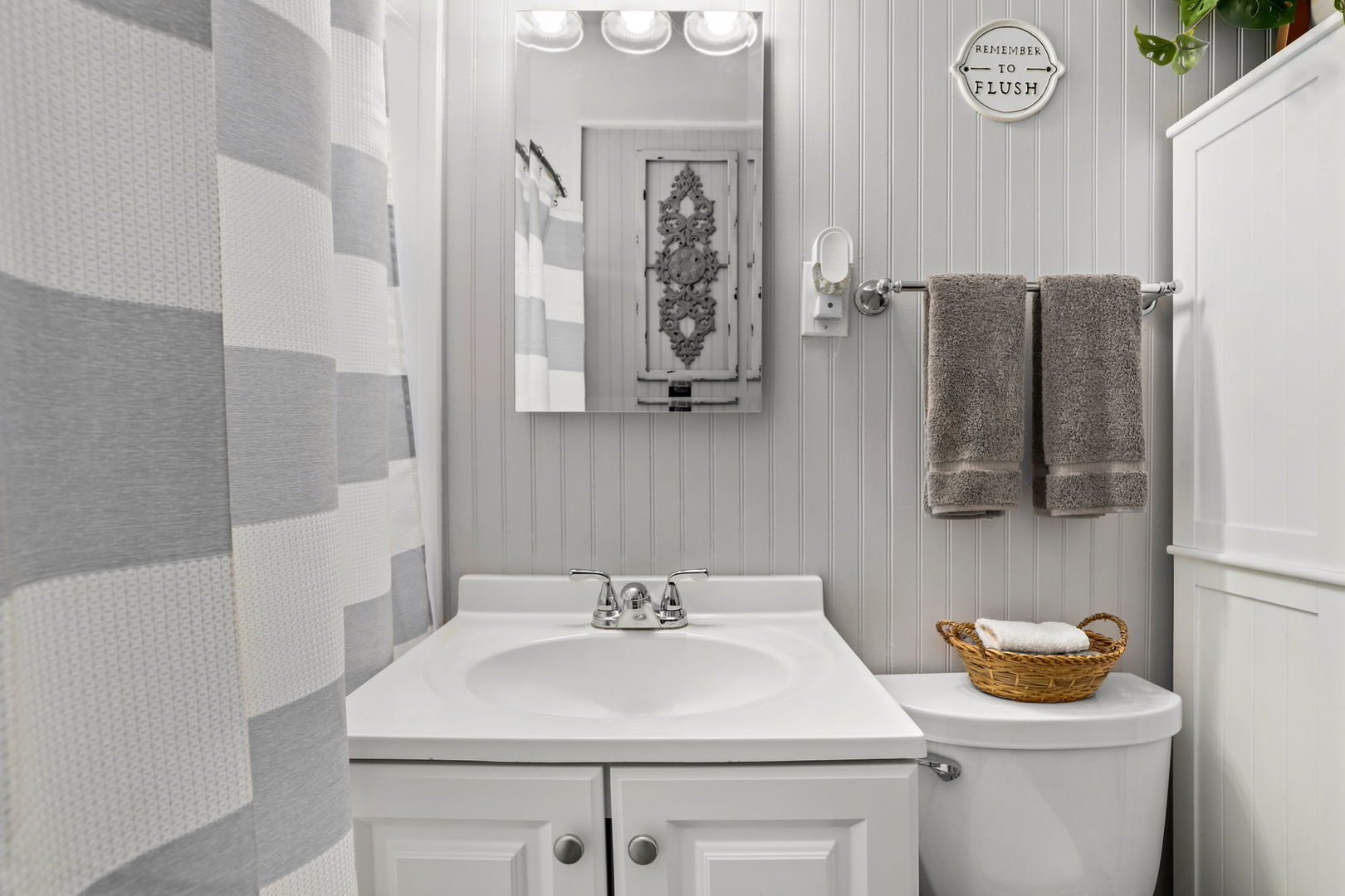 712 South Wayne Place Wheeling, IL 60090 - Photo 14 of 22 a bathroom with a sink a toilet and a mirror