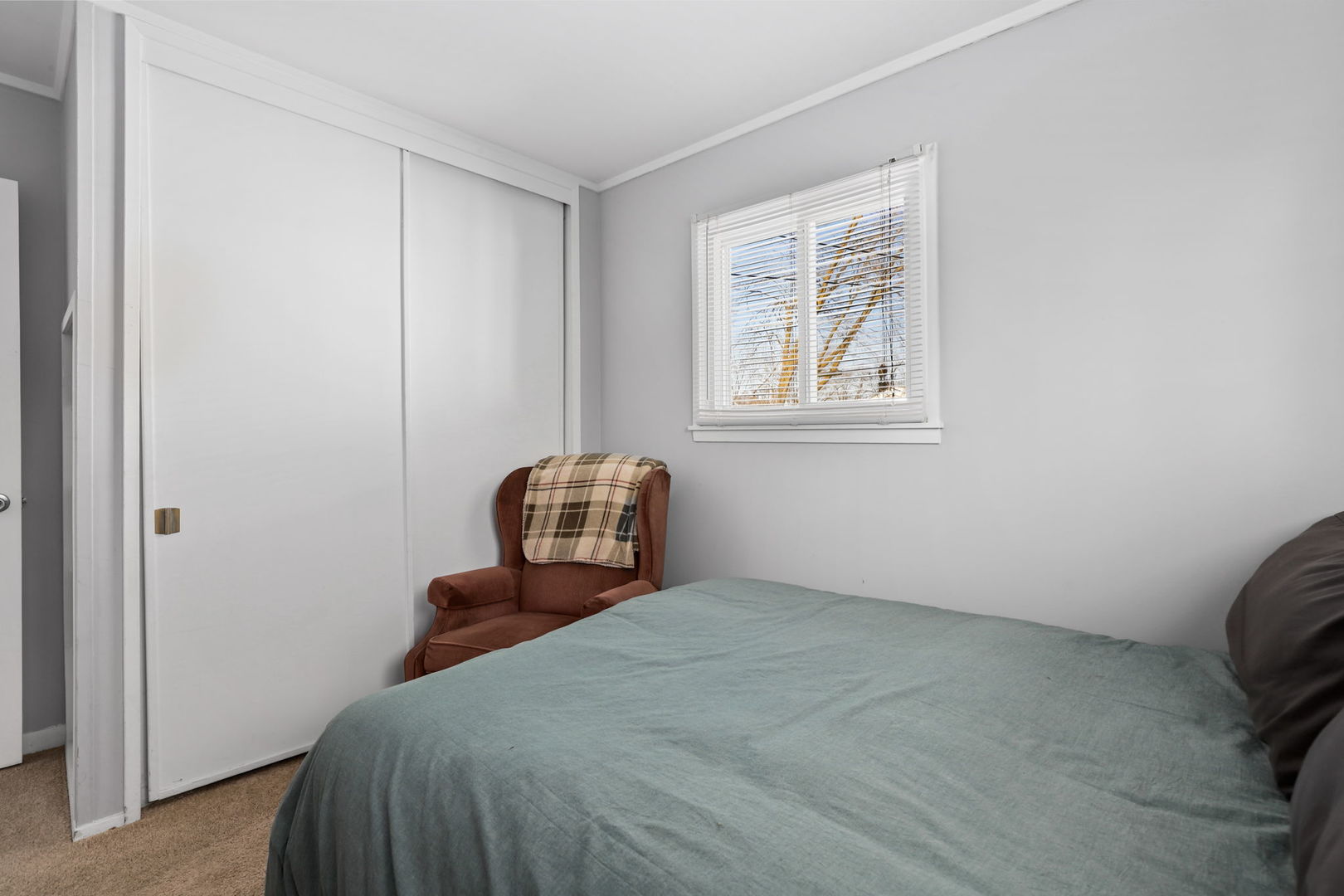 712 South Wayne Place Wheeling, IL 60090 - Photo 16 of 22 a bedroom with a bed and a window