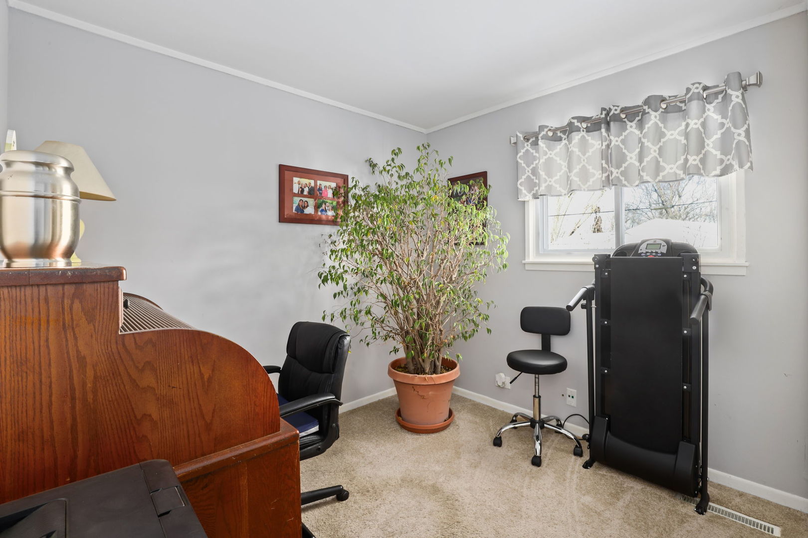 712 South Wayne Place Wheeling, IL 60090 - Photo 17 of 22 a view of a workspace with furniture and a window