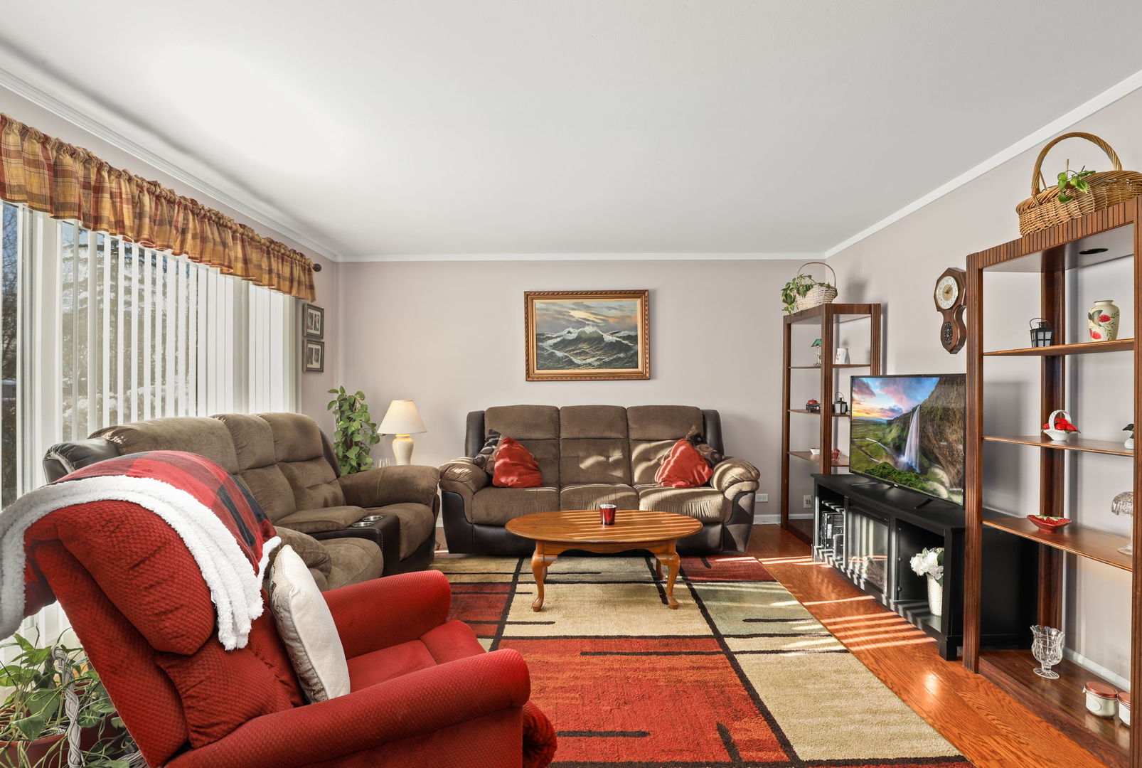 712 South Wayne Place Wheeling, IL 60090 - Photo 2 of 22 a living room with furniture a rug and a large window