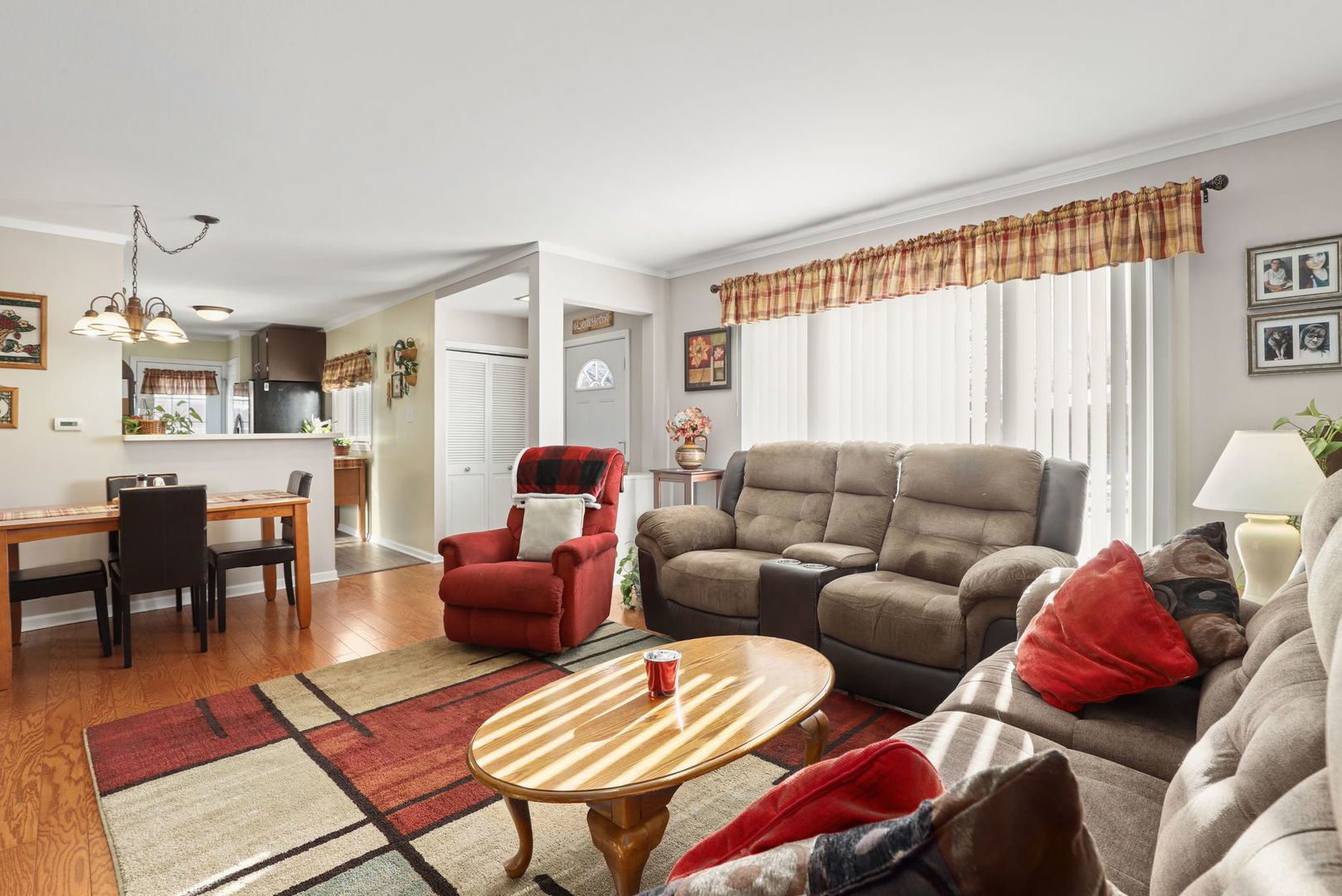 712 South Wayne Place Wheeling, IL 60090 - Photo 3 of 22 a living room with furniture and a large window