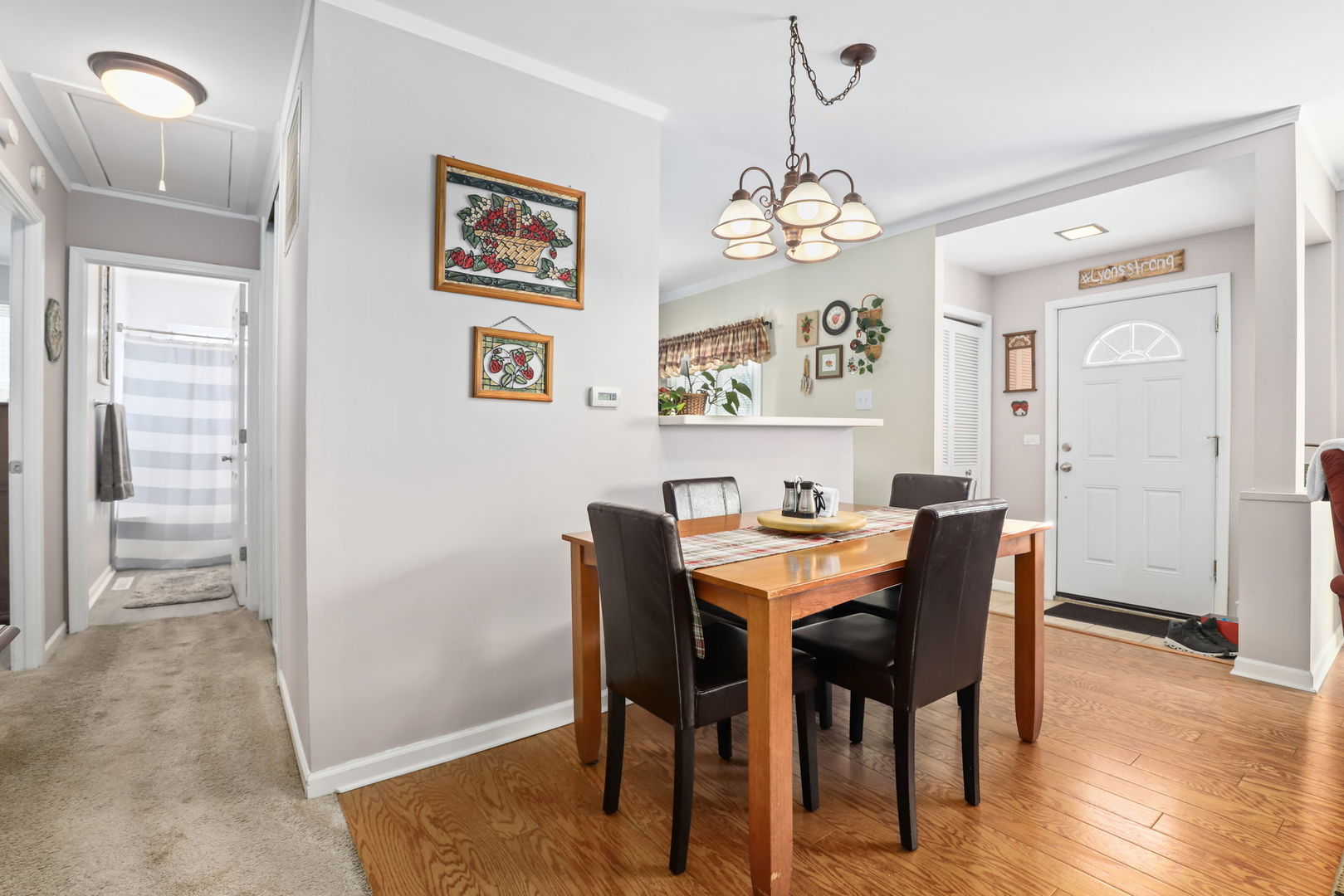 712 South Wayne Place Wheeling, IL 60090 - Photo 5 of 22 a view of a dining room with furniture and chandelier